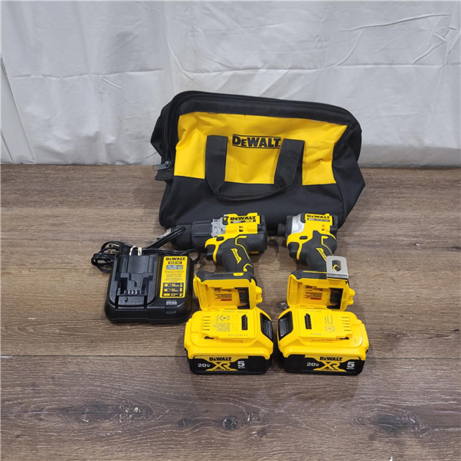 AS-IS 20V MAX XR Hammer Drill and ATOMIC Impact Driver 2 Tool Cordless Combo Kit with (2) 4.0Ah Batteries, Charger, and Bag