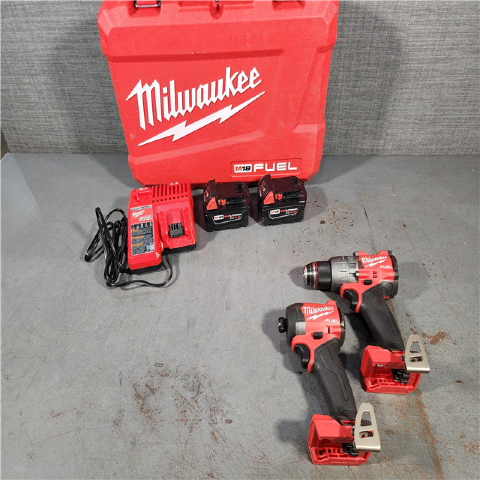 HOUSTON LOCATION - AS-IS Milwaukee M18 FUEL 18V Lithium-Ion Brushless Cordless Hammer Drill and Impact Driver Combo Kit (2-Tool) with 2 Batteries