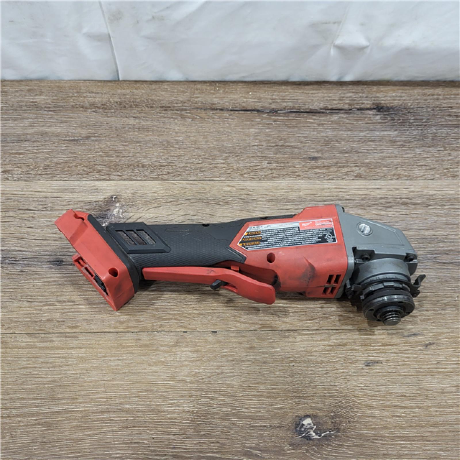 AS-IS Milwaukee 2880-20 M18 FUEL 18-Volt Lithium-Ion Brushless Cordless 4-1/2 in./5 in. Grinder W/Paddle Switch (Tool-Only)