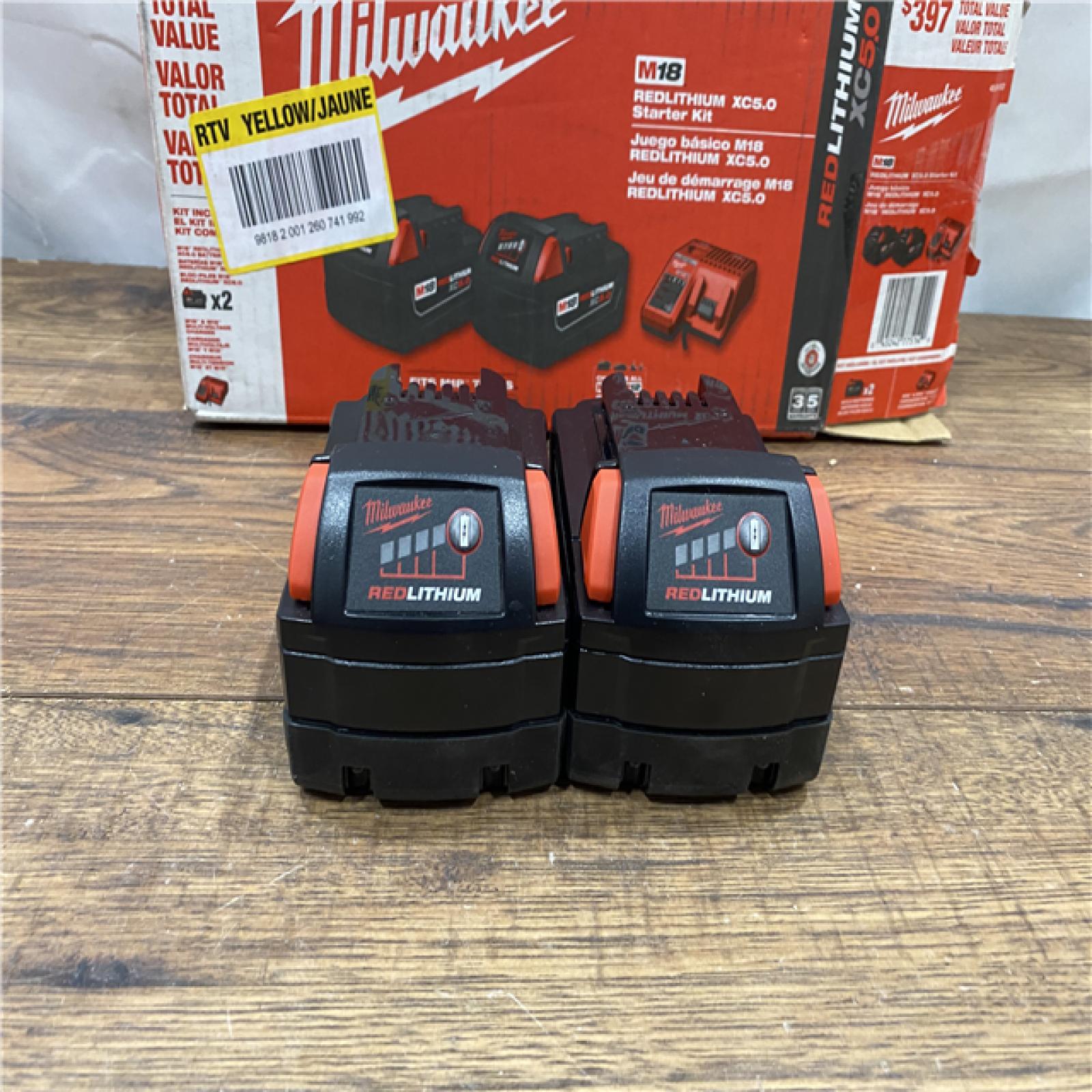 AS IS Milwaukee M18 18-Volt Lithium-Ion XC Starter Kit with Two 5.0Ah Batteries / Charger (48-59-1852B)