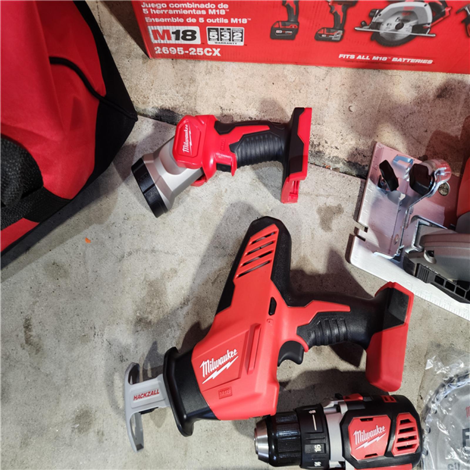 HOUSTON LOCATION - AS-IS (APPEARS LIKE NEW) Milwaukee M18 18-Volt Lithium-Ion Cordless Combo Tool Kit (5-Tool) with (1) 3.0Ah and (1) 1.5Ah Battery, (1) Charger, (1) Tool Bag