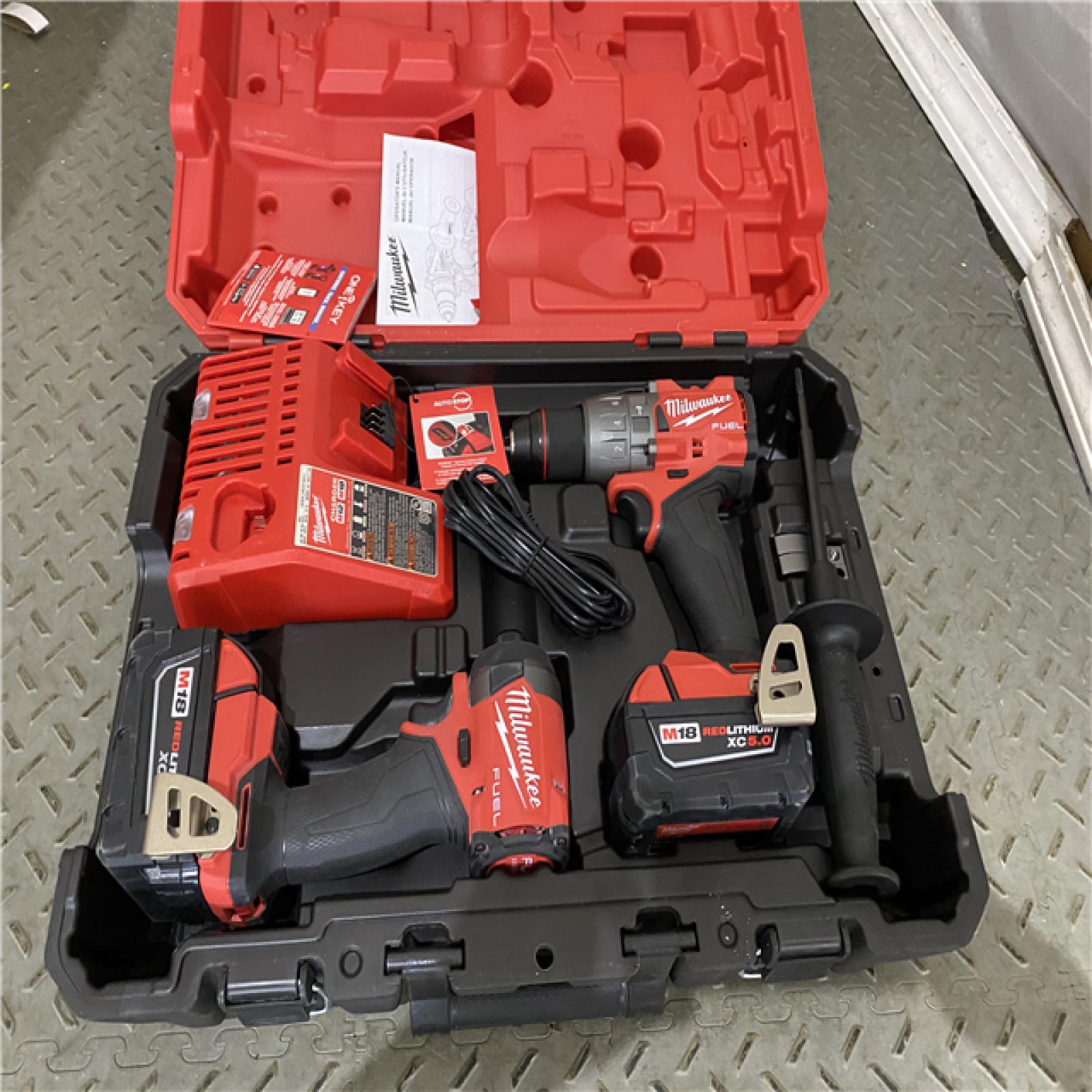 Houston location AS-IS Milwaukee 3697-22 M18 FUEL 1/2 Hammer Driller/Driver &1/4 Hex Impact Driver 2 Tool Combo Kit