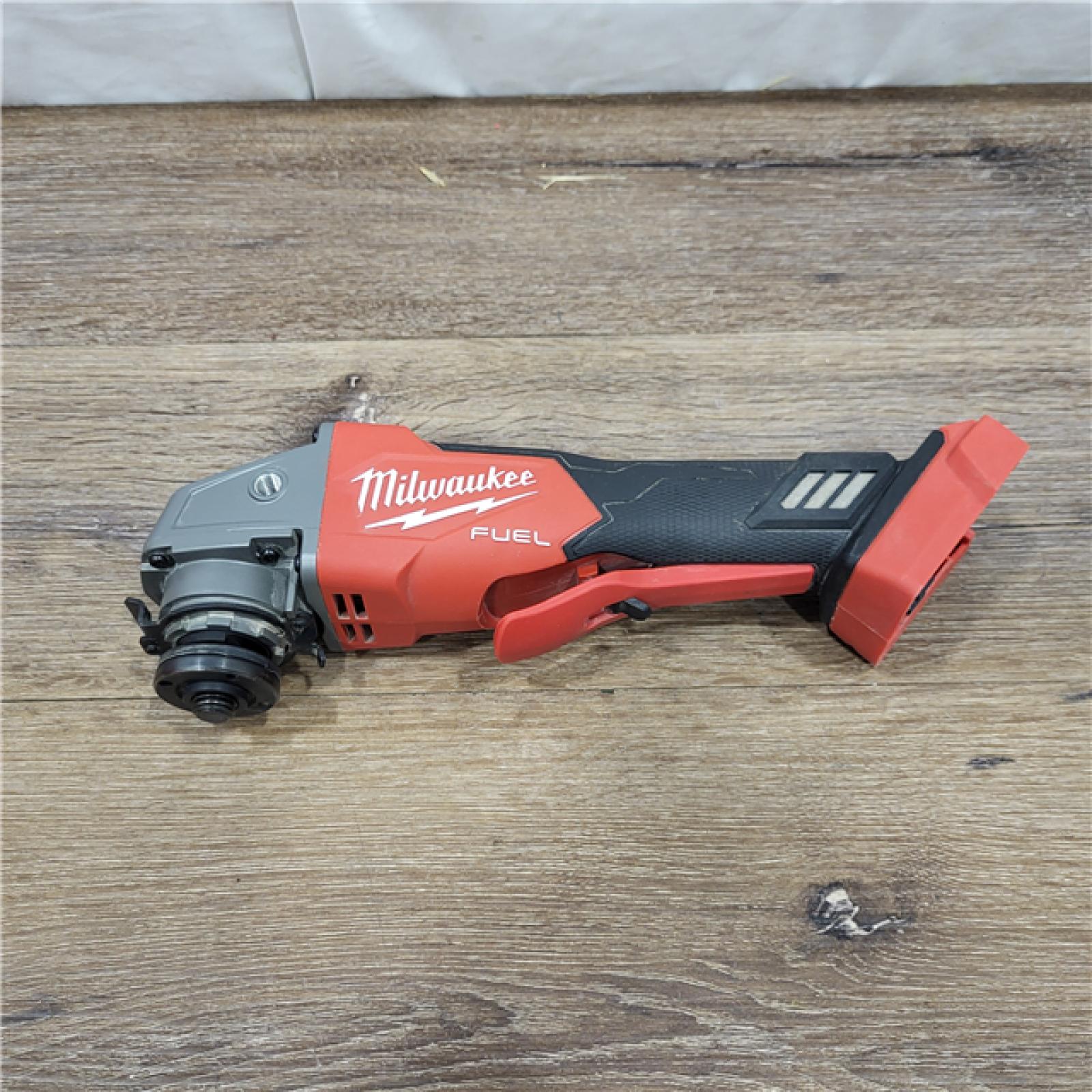 AS-IS Milwaukee 2880-20 M18 FUEL 18-Volt Lithium-Ion Brushless Cordless 4-1/2 in./5 in. Grinder W/Paddle Switch (Tool-Only)