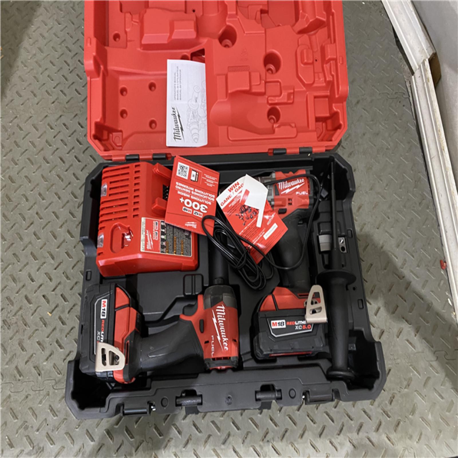 Houston location AS-IS Milwaukee 3697-22 M18 FUEL 1/2 Hammer Driller/Driver &1/4 Hex Impact Driver 2 Tool Combo Kit