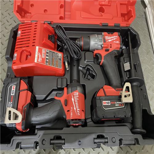 Houston location AS-IS Milwaukee 3697-22 M18 FUEL 1/2 Hammer Driller/Driver &1/4 Hex Impact Driver 2 Tool Combo Kit