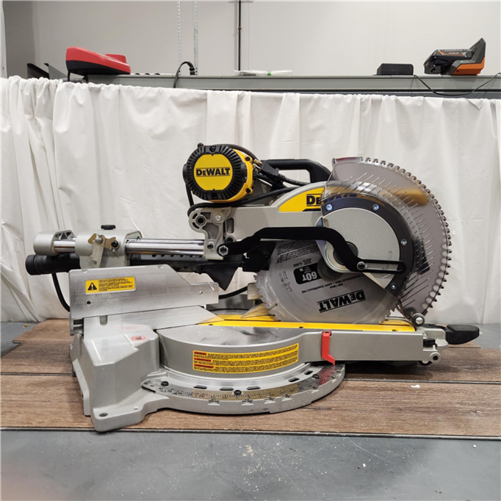 AS IS DEWALT 15 Amp Corded 12 in. Double Bevel Sliding Compound Miter Saw with XPS Technology, Blade Wrench and Material Clamp