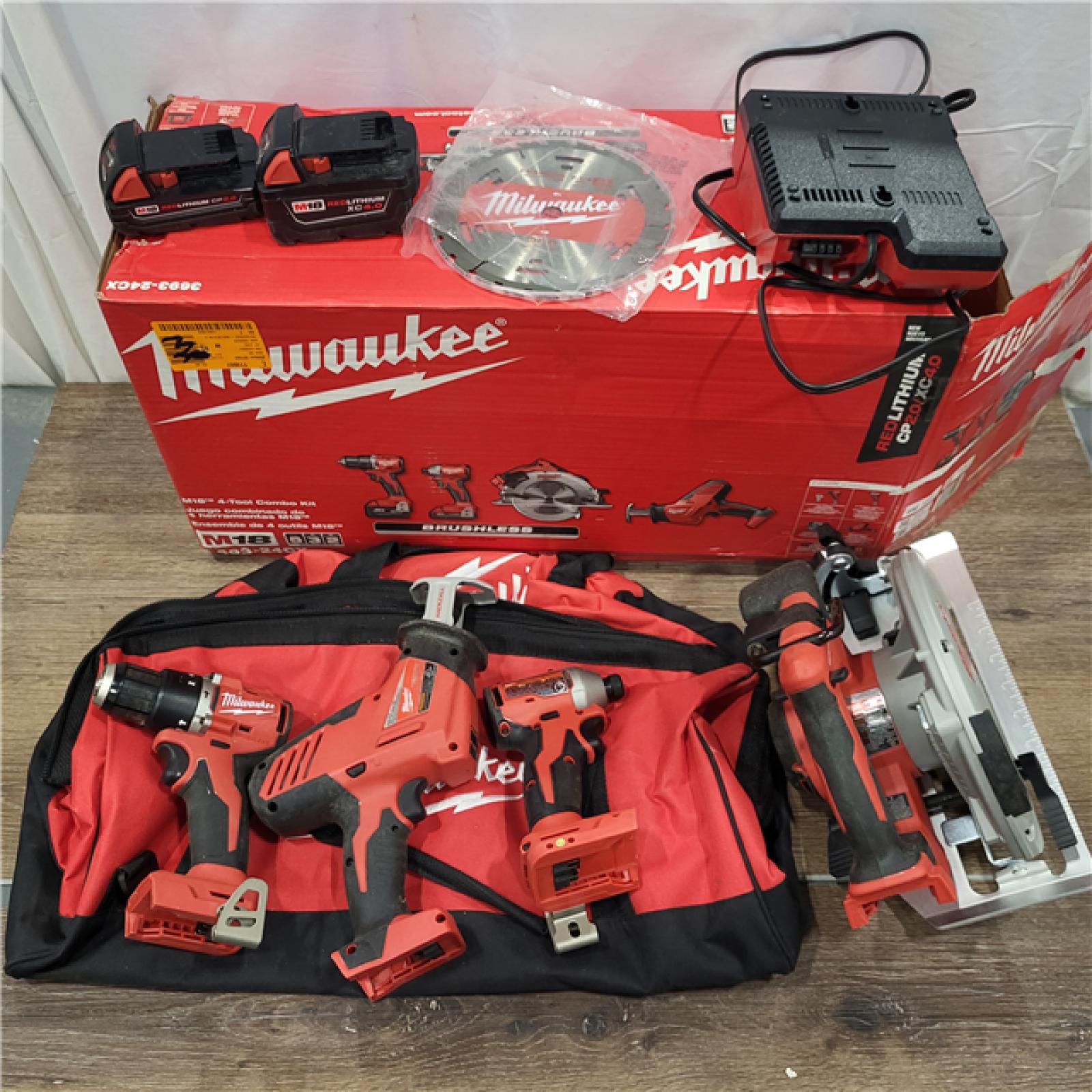 AS-IS Milwaukee M18 18-Volt Lithium-Ion Brushless Cordless Combo Kit (4-Tool) with 2-Batteries, 1-Charger and Tool Bag