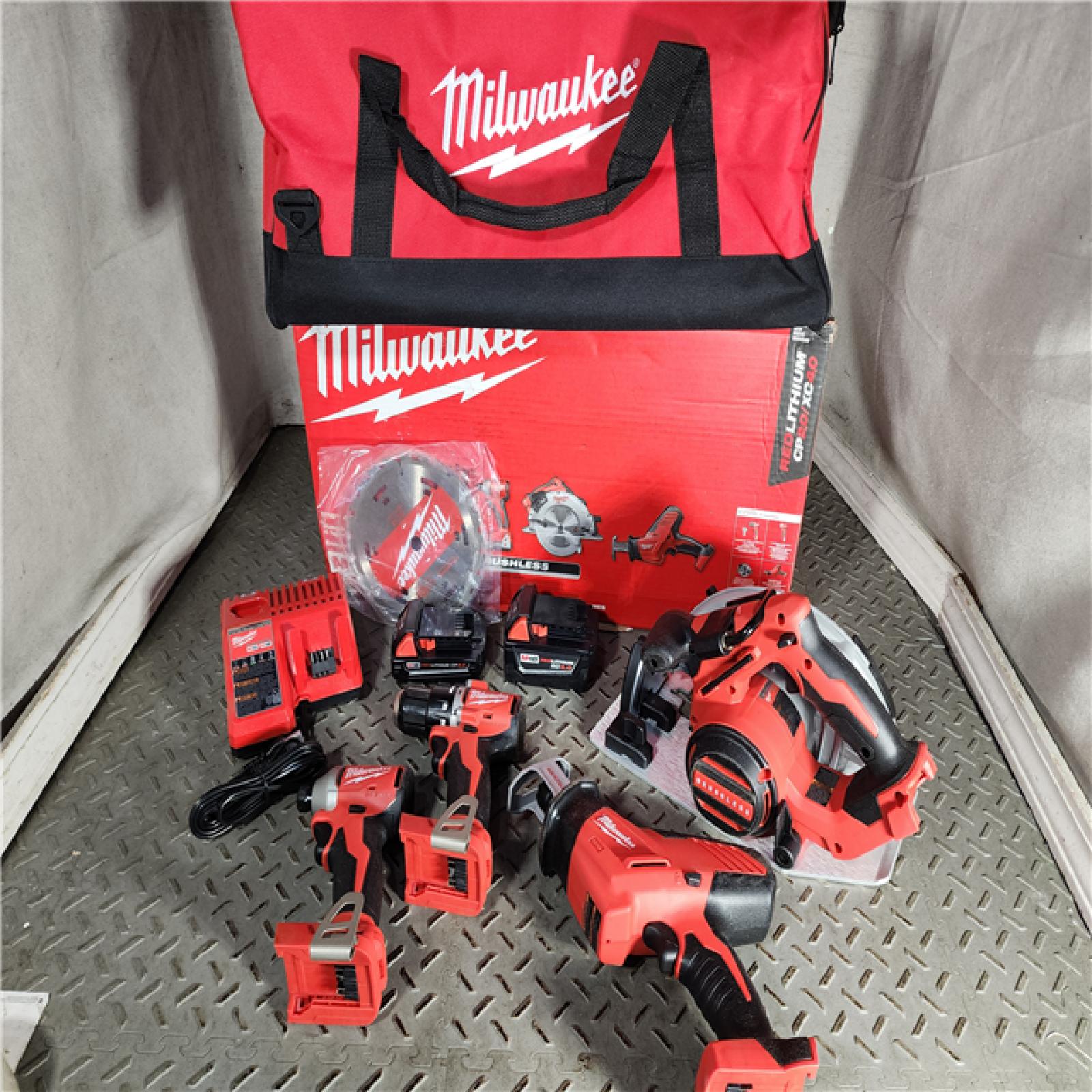 HOUSTON LOCATION - AS-IS (APPEARS LIKE NEW) Milwaukee M18 18-Volt Lithium-Ion Brushless Cordless Combo Kit (4-Tool) with 2-Batteries, 1-Charger and Tool Bag