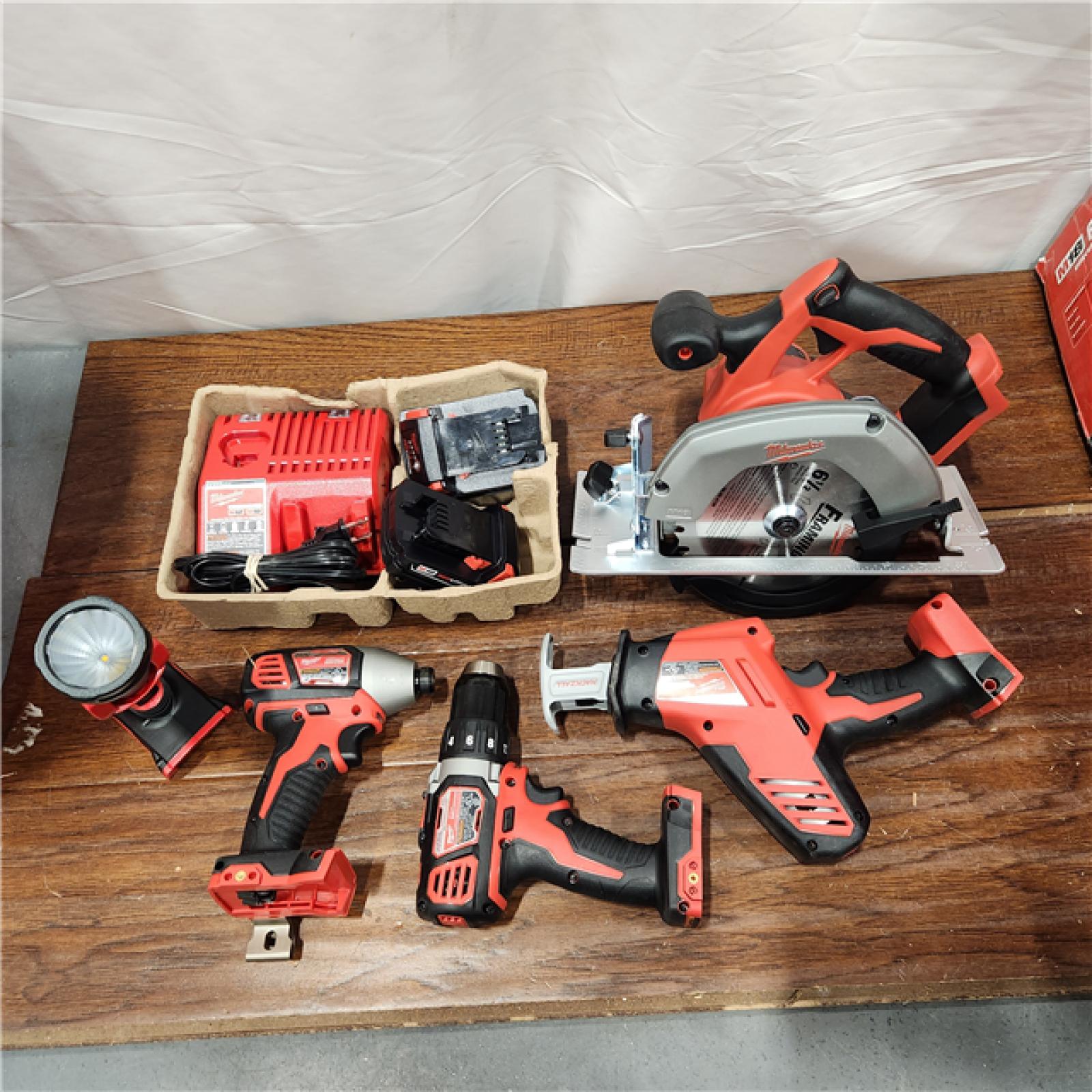 AS-IS Milwaukee M18 18-Volt Lithium-Ion Cordless Combo Tool Kit (5-Tool) with (1) 3.0Ah and (1) 1.5Ah Battery, (1) Charger, (1) Tool Bag