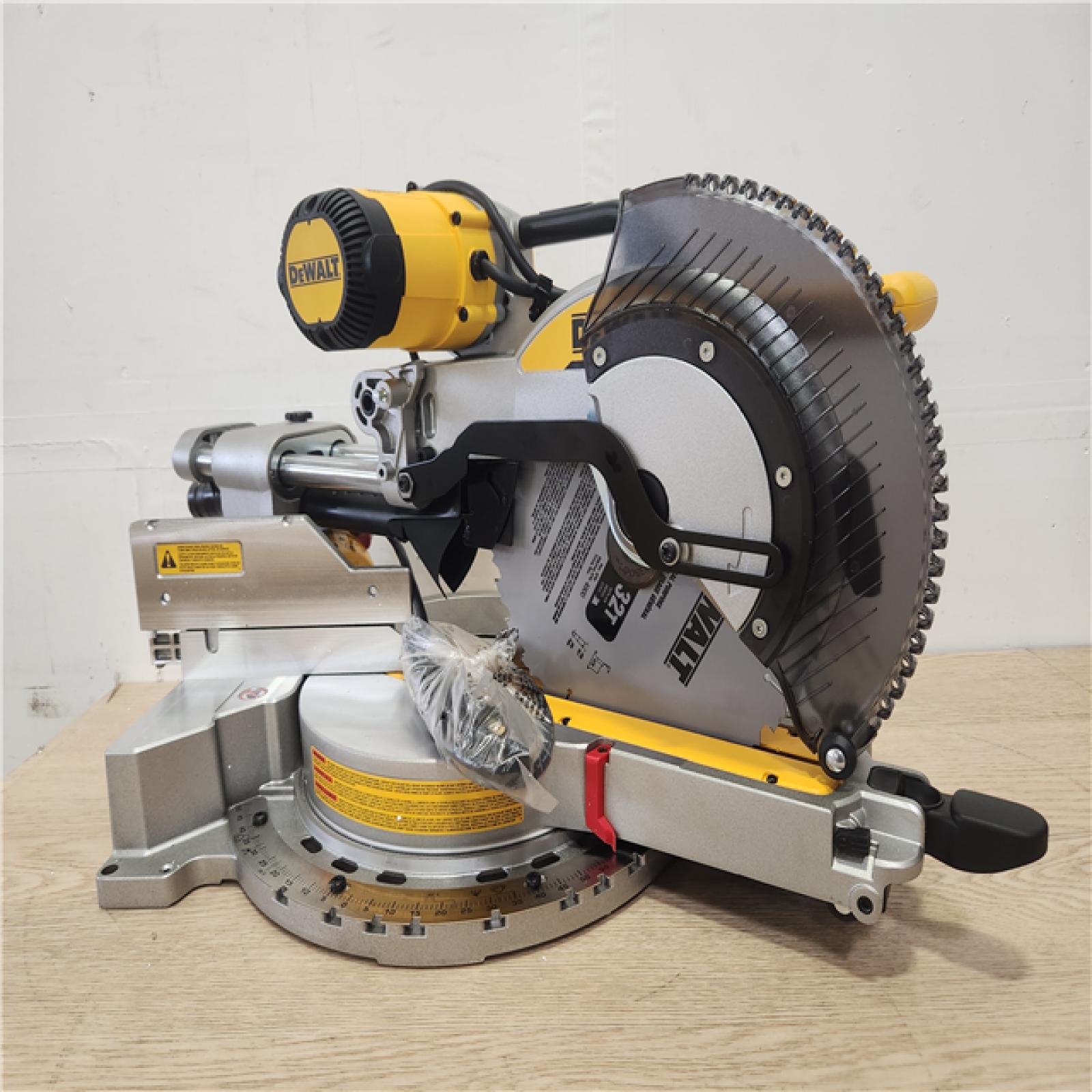 Phoenix Location Appears NEW DEWALT 15 Amp Corded 12 in. Double Bevel Sliding Compound Miter Saw, Blade Wrench and Material Clamp DWS779