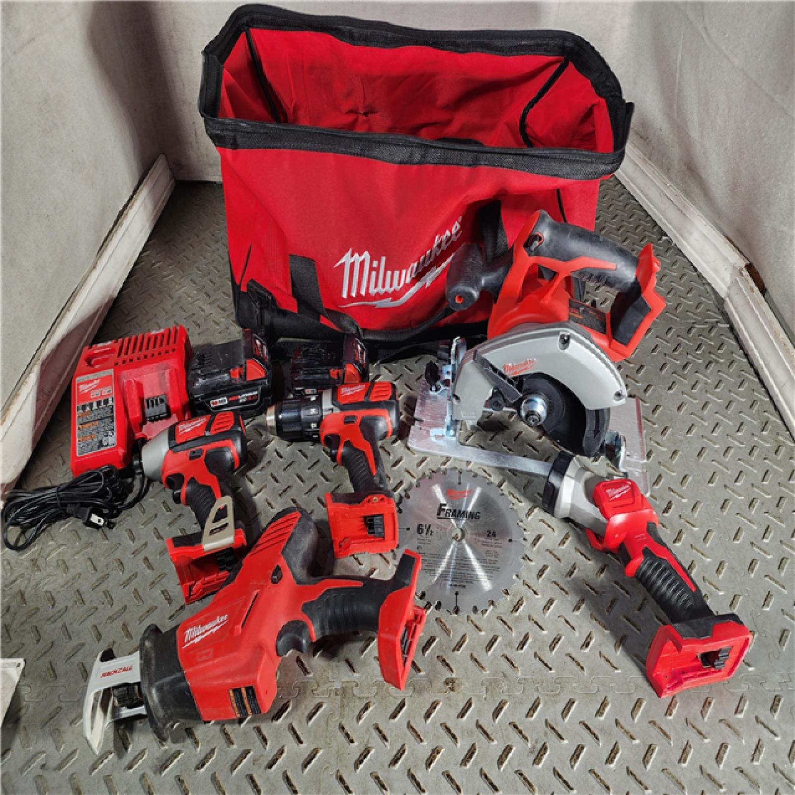 HOUSTON LOCATION - AS-IS Milwaukee M18 18-Volt Lithium-Ion Cordless Combo Tool Kit (5-Tool) with (1) 3.0Ah and (1) 1.5Ah Battery, (1) Charger, (1) Tool Bag