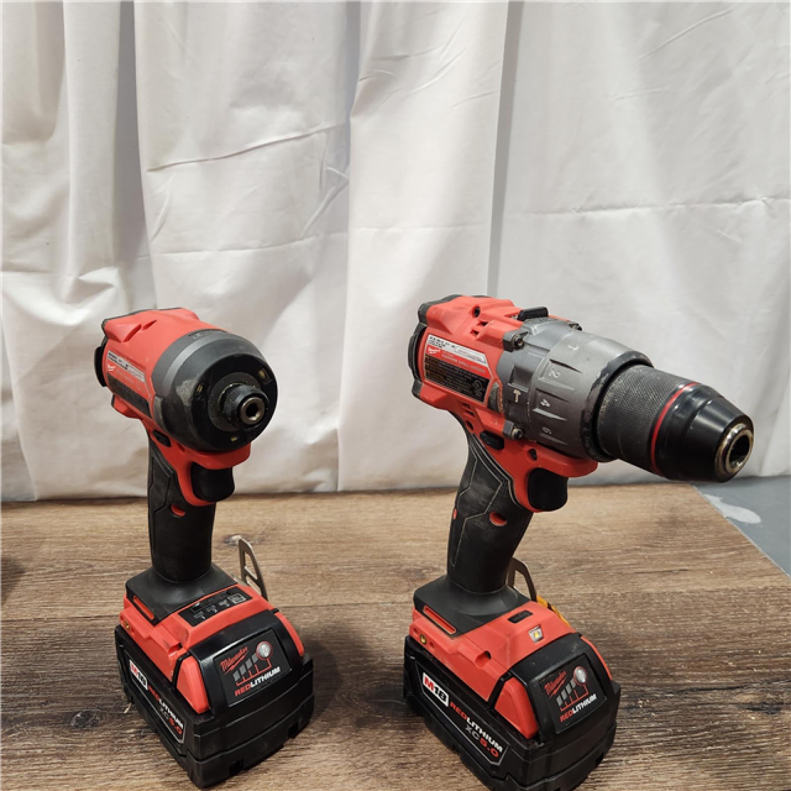 AS-IS Milwaukee M18 FUEL 18V Lithium-Ion Brushless Cordless Hammer Drill and Impact Driver Combo Kit (2-Tool) with 2 Batteries