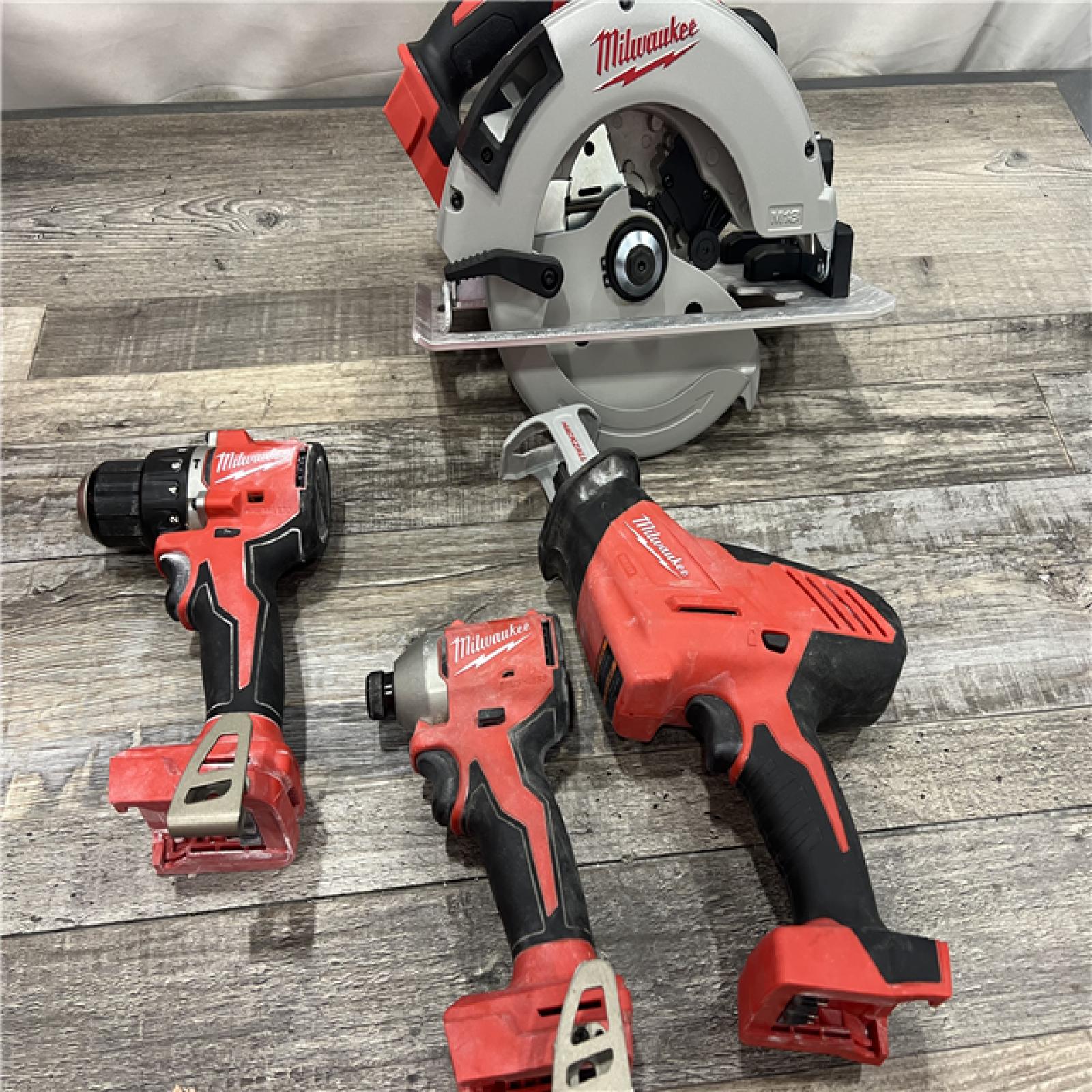 AS-IS MILWAUKEE M18 18-Volt Lithium-Ion Brushless Cordless Combo Kit (4-Tool) with 2-Batteries, 1-Charger and Tool Bag