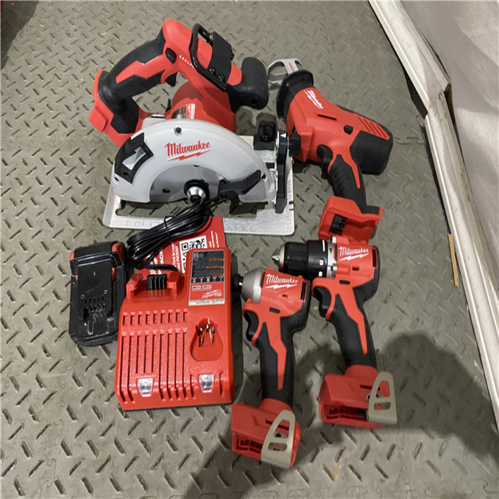 Houston location AS-IS MILWAUKEE M18 18-Volt Lithium-Ion Brushless Cordless Combo Kit (4-Tool) with 1Battery 1-Charger and Tool Bag MISSING ONE BATTERY