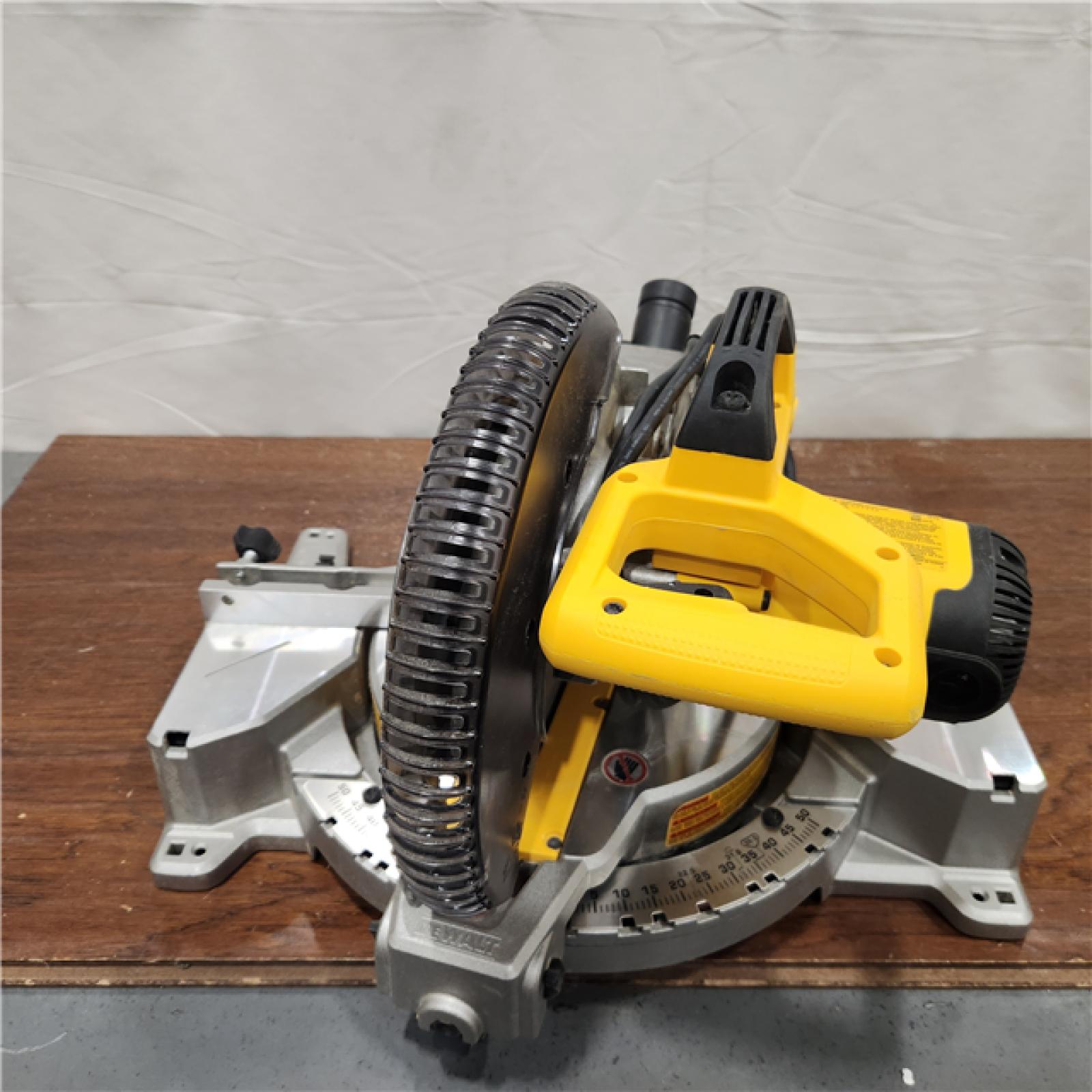 AS-IS DEWALT 15 Amp Corded 12 in. Double Bevel Sliding Compound Miter Saw with XPS Technology, Blade Wrench and Material Clamp