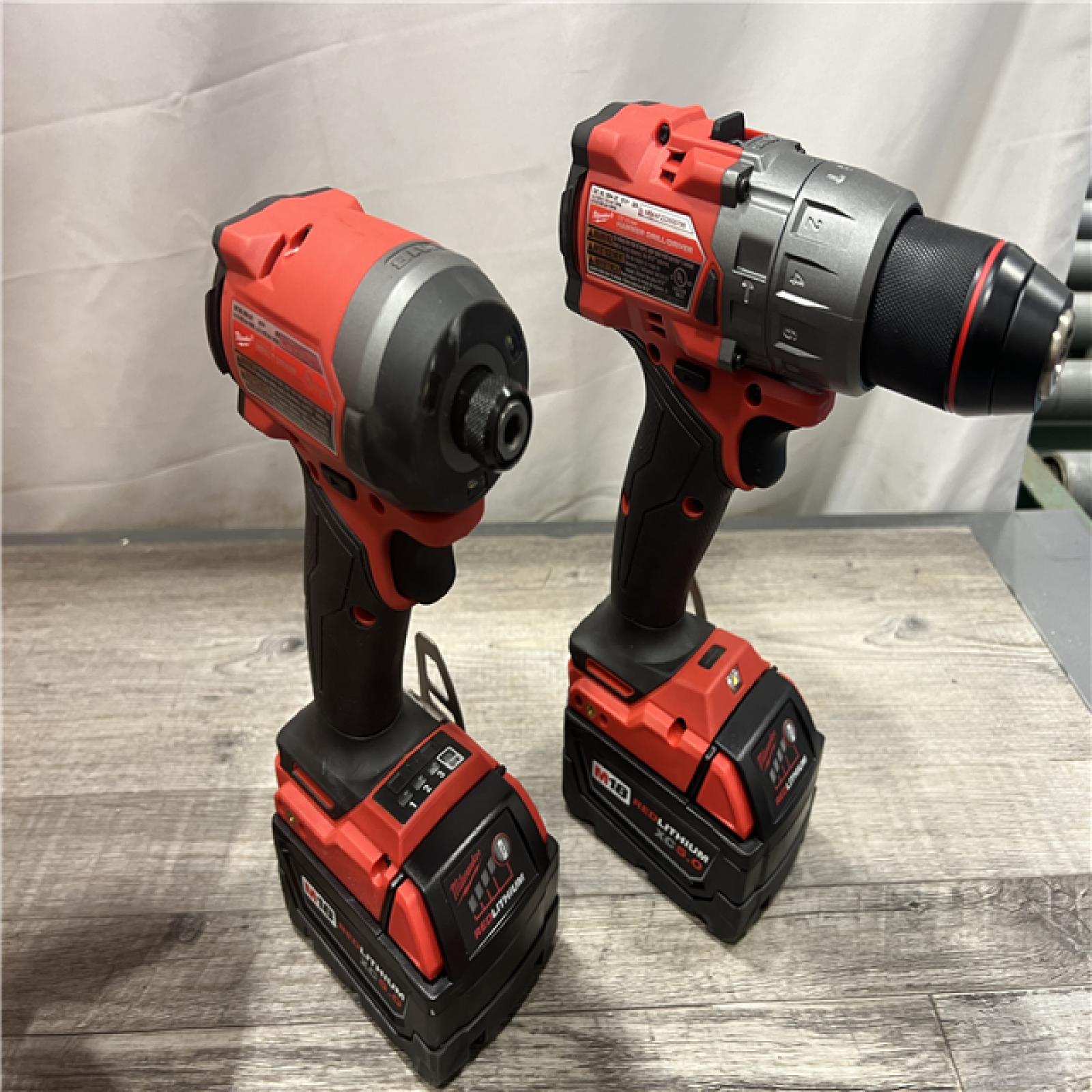 AS-IS MILWAUKEE M18 FUEL 18V Lithium-Ion Brushless Cordless Hammer Drill and Impact Driver Combo Kit (2-Tool) with 2 Batteries