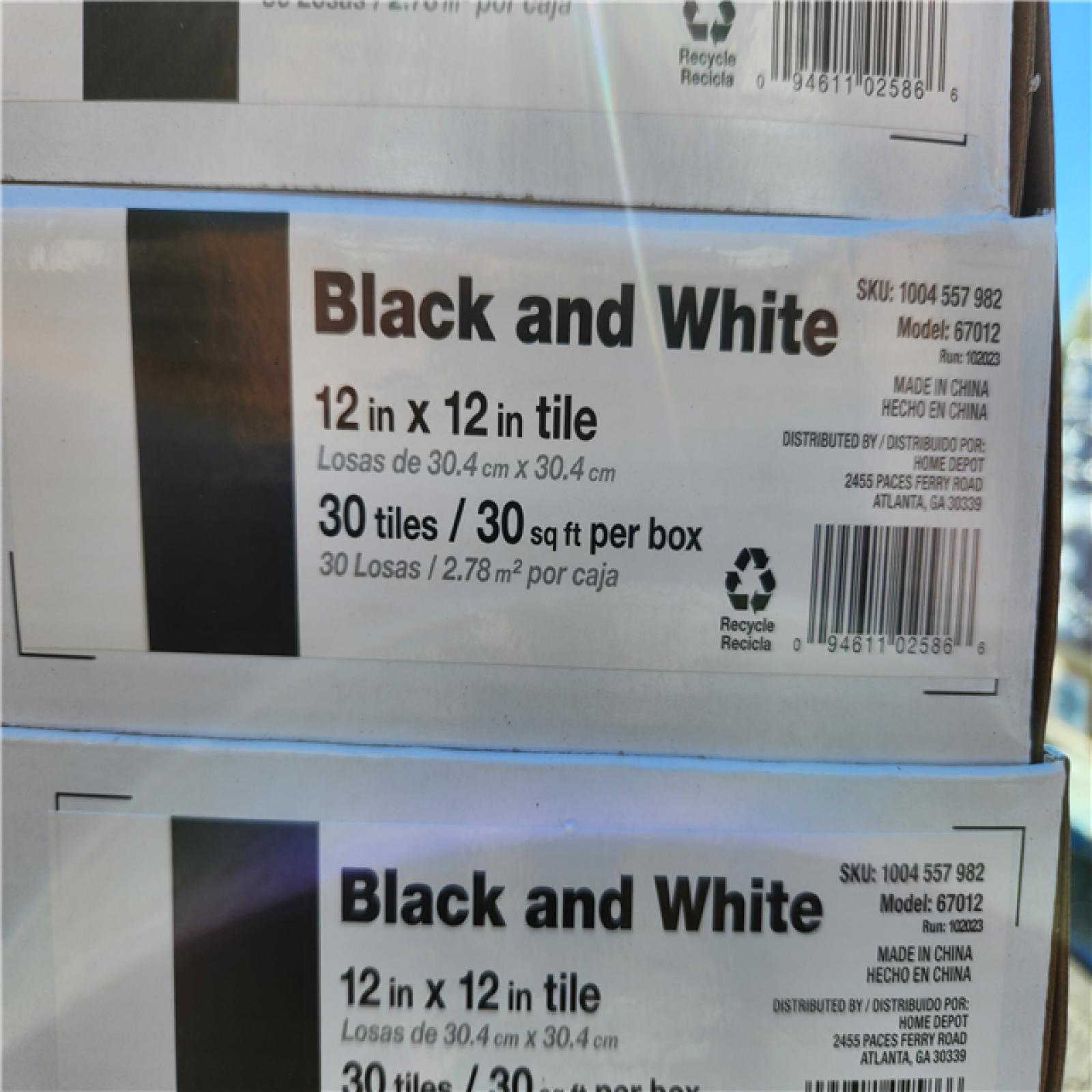 Phoenix Location TrafficMaster Black and White 4 MIL x 12 in. W x 12 in. L Peel and Stick Water Resistant Vinyl Tile Flooring (1080 sqft 36 case)