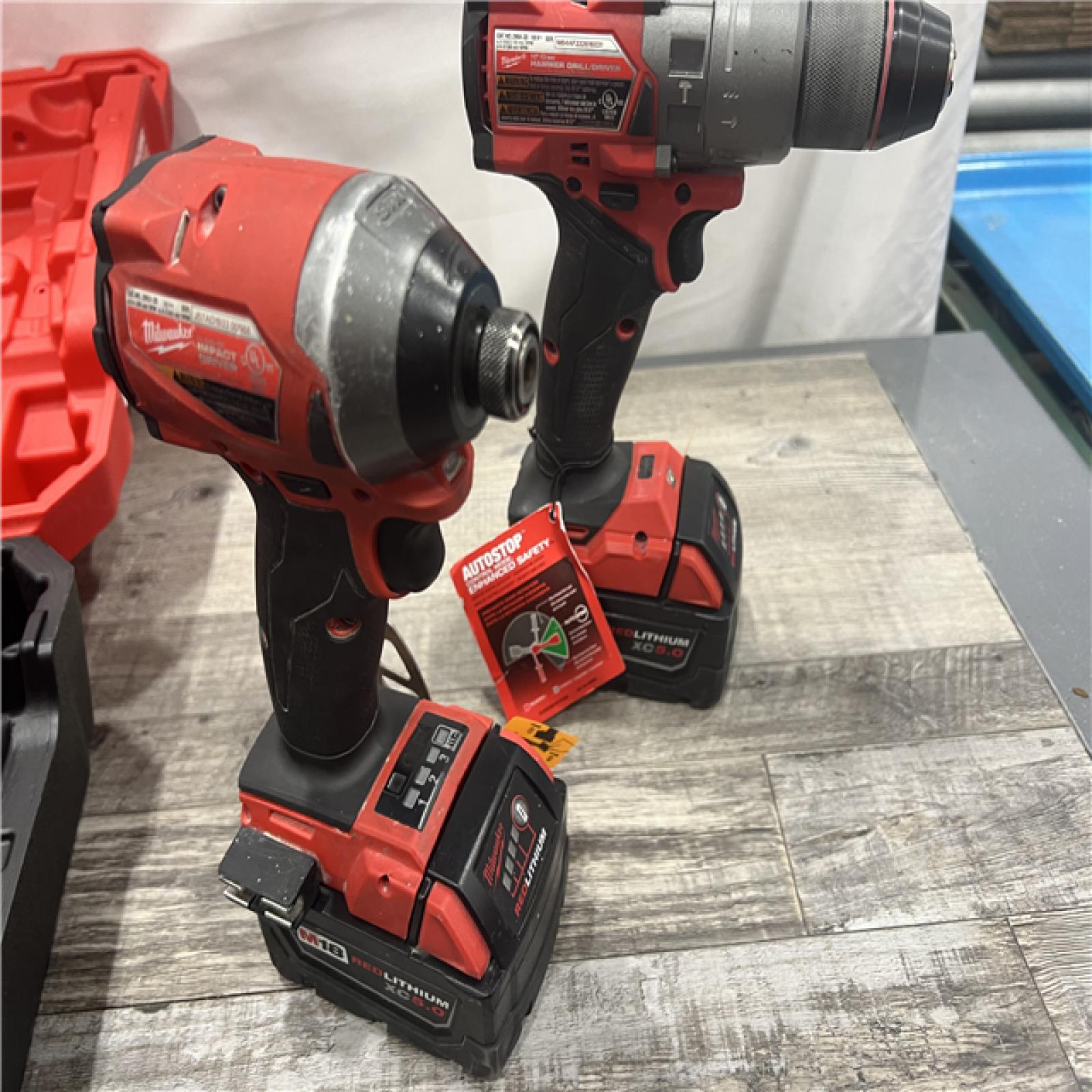 AS-IS MILWAUKEE M18 FUEL 18V Lithium-Ion Brushless Cordless Hammer Drill and Impact Driver Combo Kit (2-Tool) with 2 Batteries