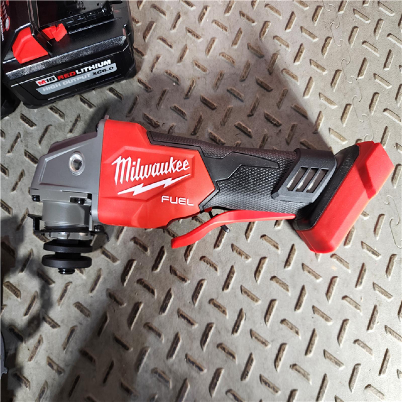 HOUSTON LOCATION - AS-IS (APPEARS LIKE NEW) 1 Set  Milwaukee 2880-22 M18 4.5  - 5  Cordless No-Lock Grinder Paddle Switch Kit