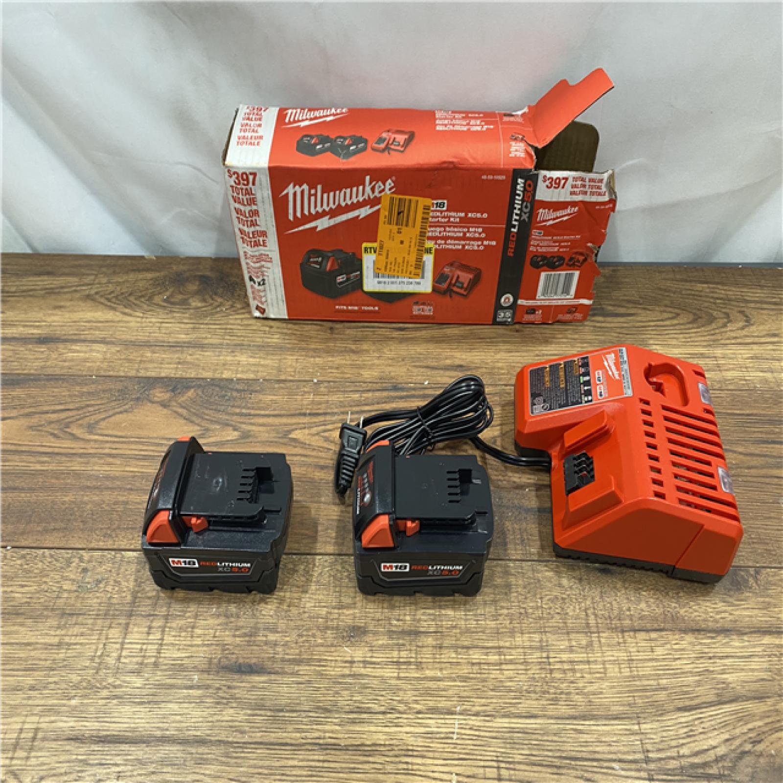 AS IS M18 18-Volt Lithium-Ion XC Starter Kit with Two 5.0Ah Batteries and Charger