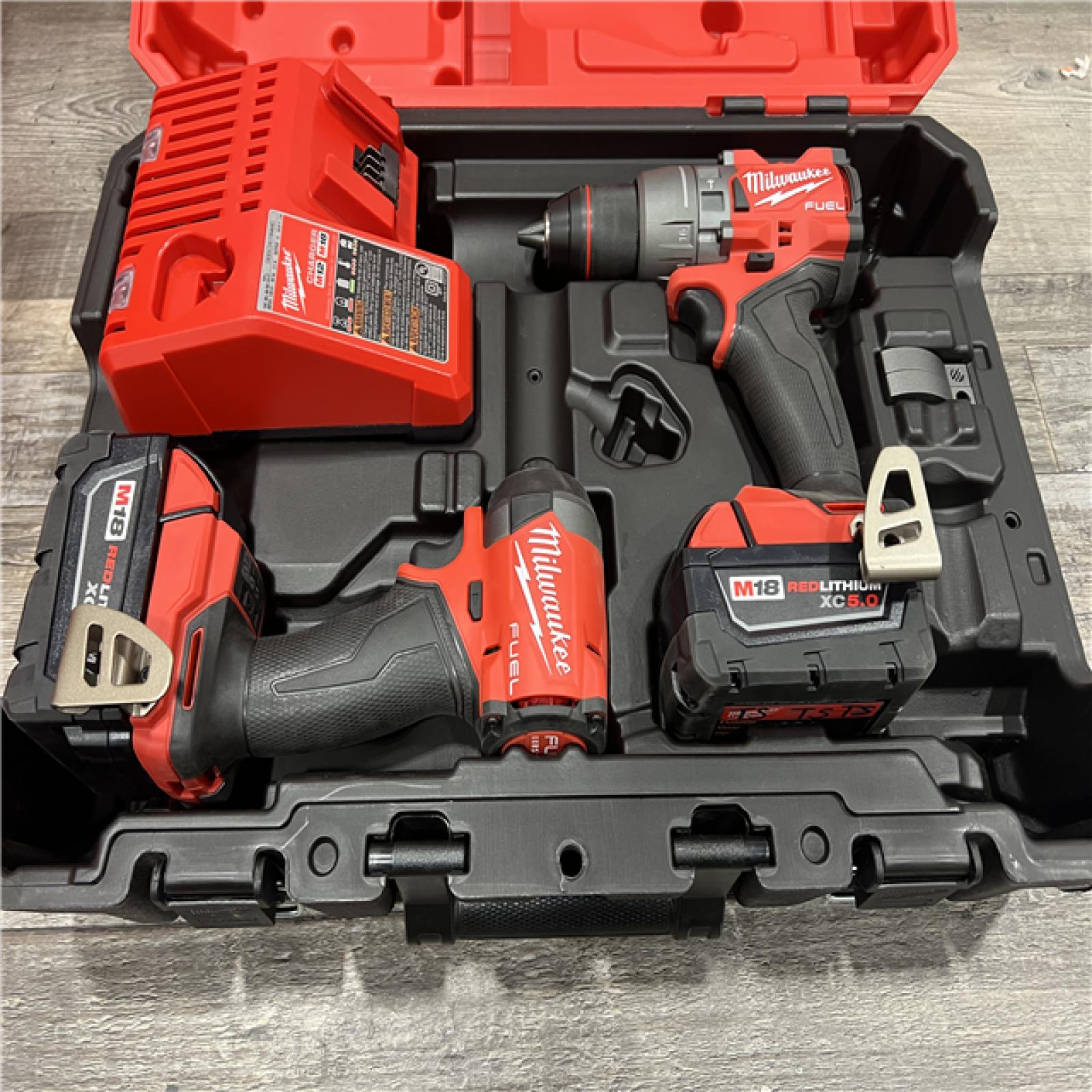 AS-IS Milwaukee M18 FUEL 18V Lithium-Ion Brushless Cordless Hammer Drill and Impact Driver Combo Kit (2-Tool) with 2 Batteries