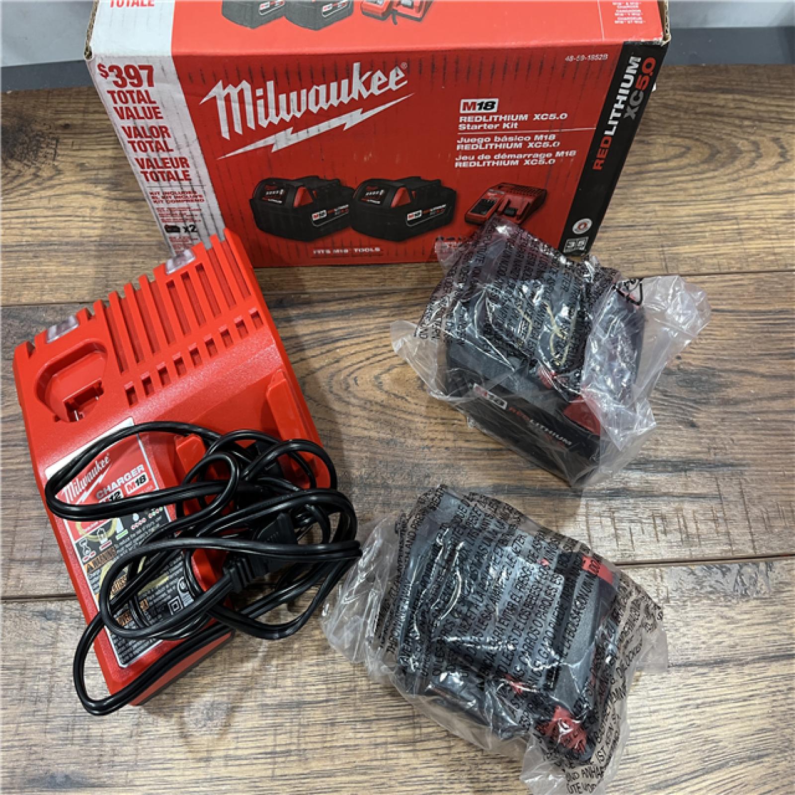 AS-IS Milwaukee M18 18-Volt Lithium-Ion XC Starter Kit with Two 5.0Ah Batteries / Charger (48-59-1852B)