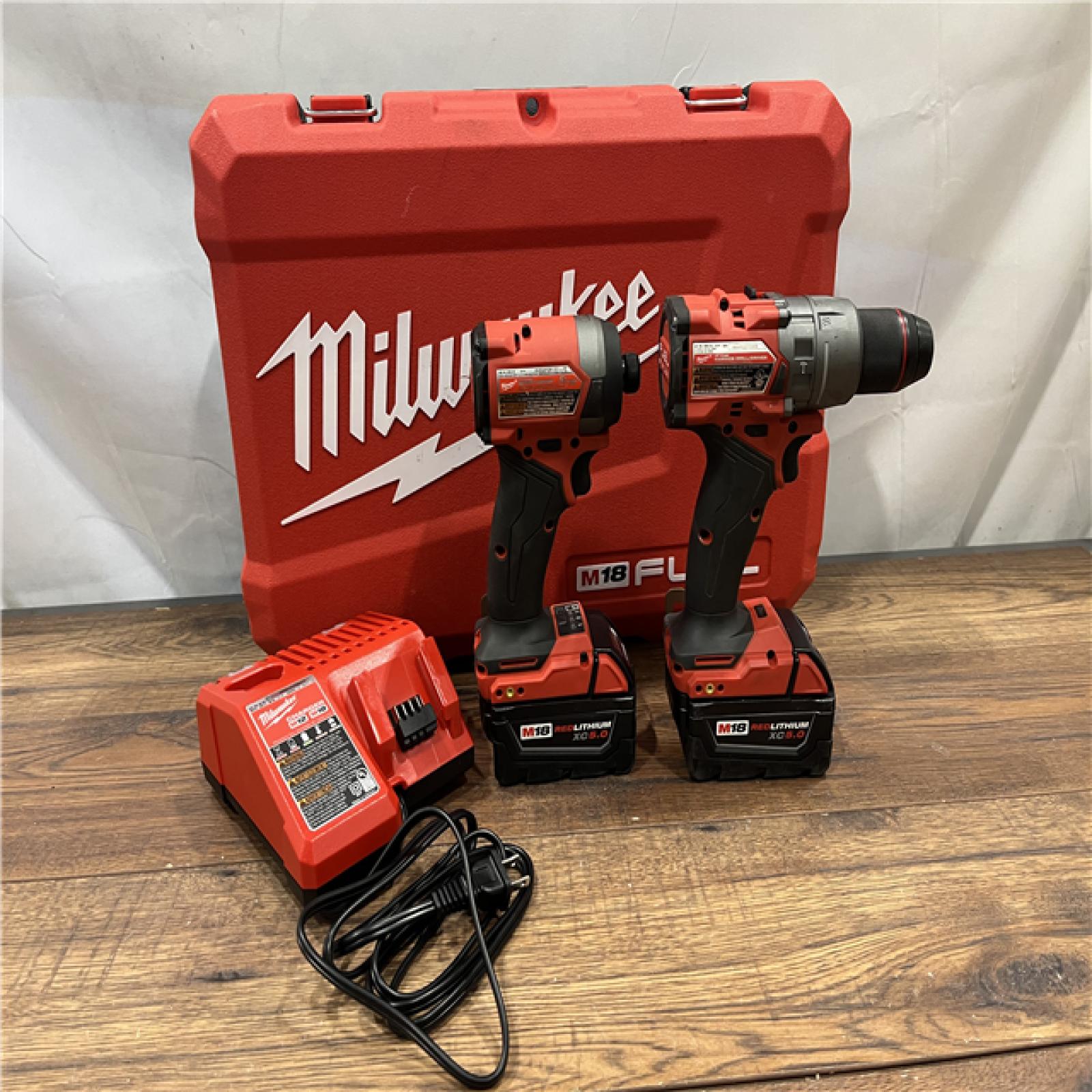 AS-IS Milwaukee M18 FUEL 18V Lithium-Ion Brushless Cordless Hammer Drill and Impact Driver Combo Kit (2-Tool) with 2 Batteries