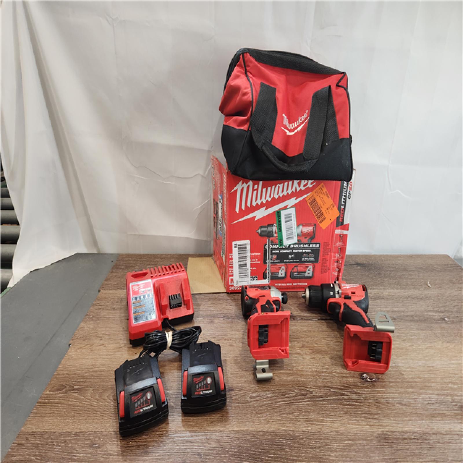 AS-IS Milwaukee 3692-22CT 18V M18 Lithium-Ion Compact Brushless Cordless 2-Tool Combo Kit with 1/2 Drill/Driver and 1/4 Hex Impact Driver 2.0 Ah