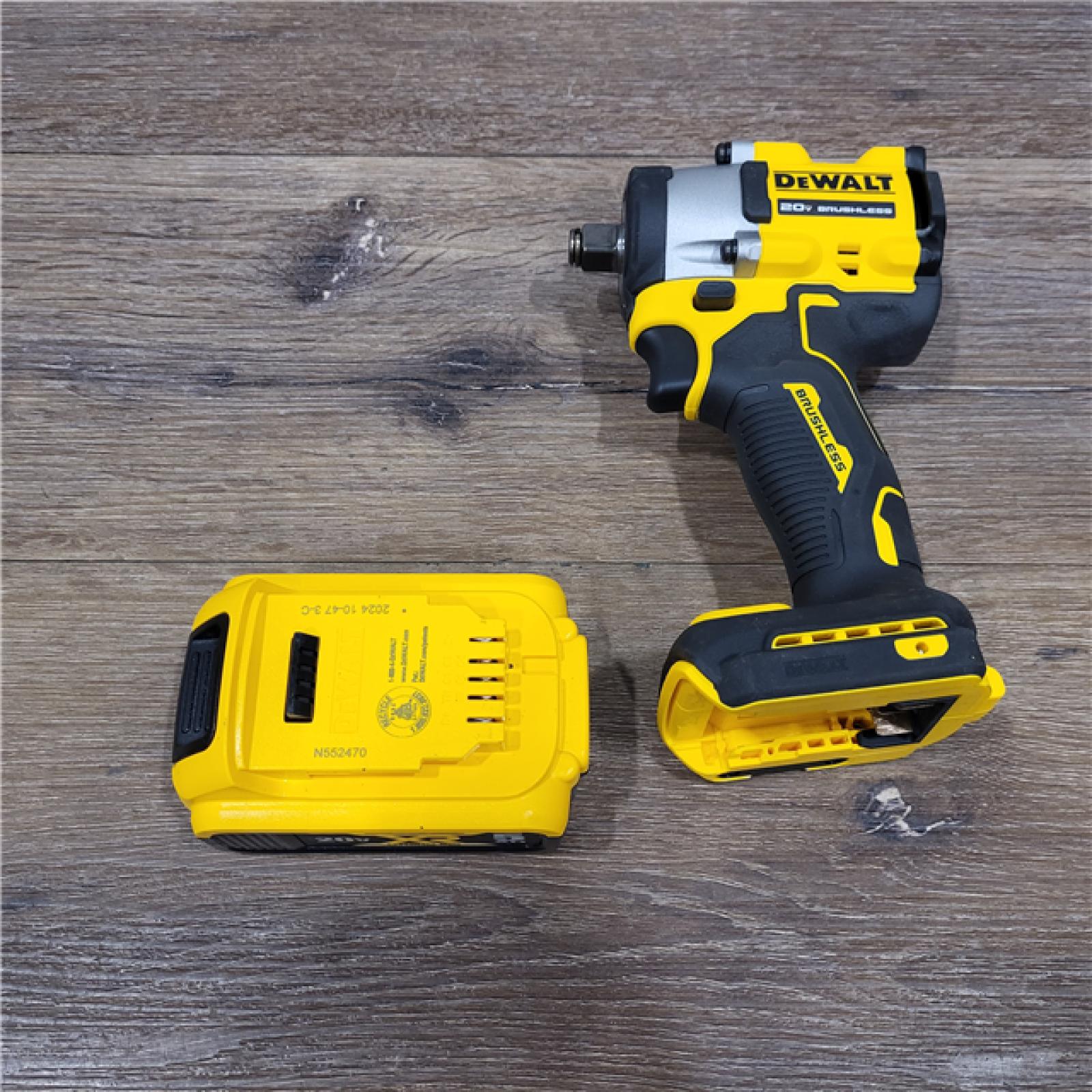 AS-IS DEWALT ATOMIC 20V MAX Lithium-Ion Brushless Cordless 1/2 in. Variable Speed Impact Wrench Kit with 5 Ah Battery and Charger