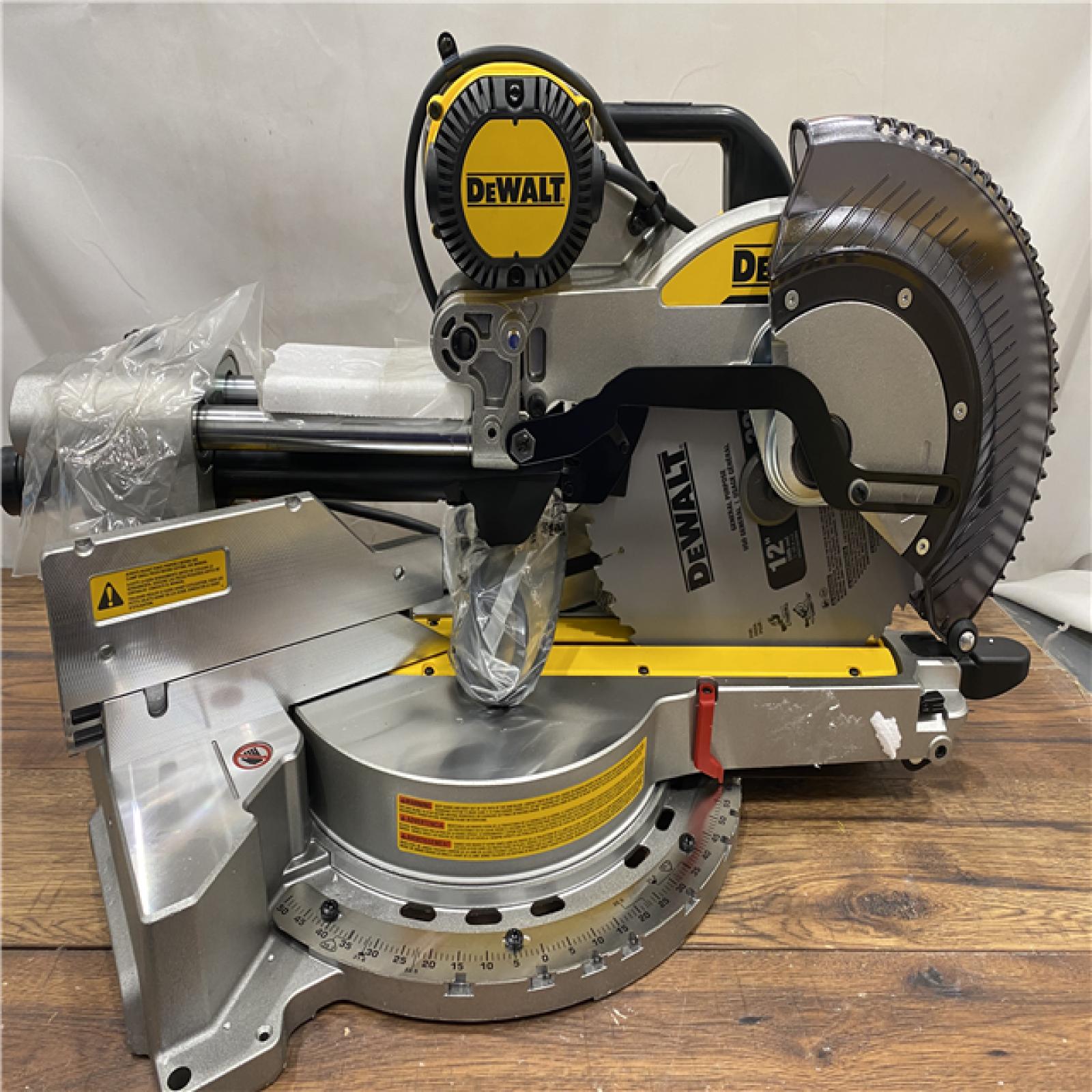 AS IS DEWALT 15 Amp Corded 12 in. Double Bevel Sliding Compound Miter Saw, Blade Wrench and Material Clamp