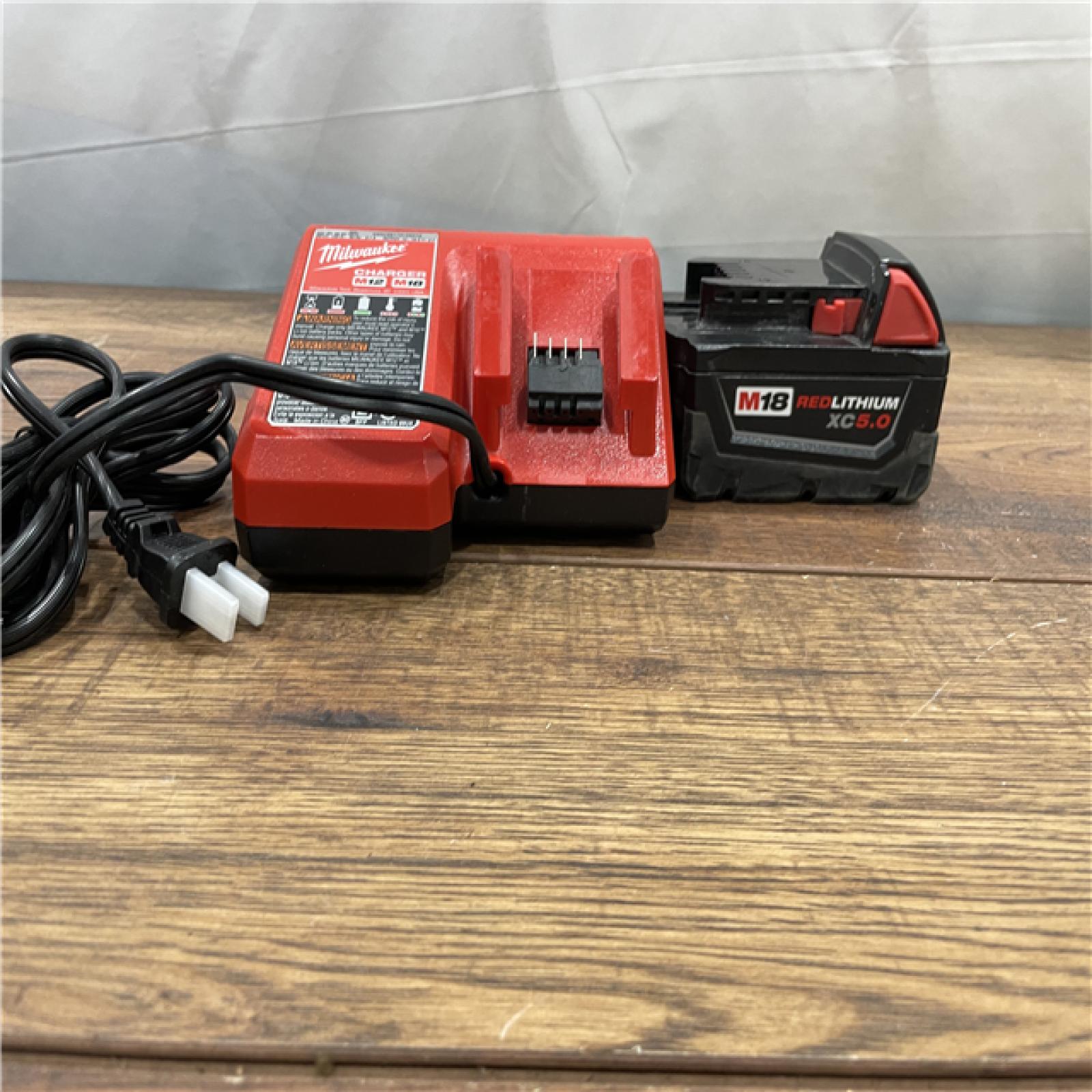 AS-IS Milwaukee M18 18-Volt Lithium-Ion XC Starter Kit with (1) 5.0Ah Battery and Charger