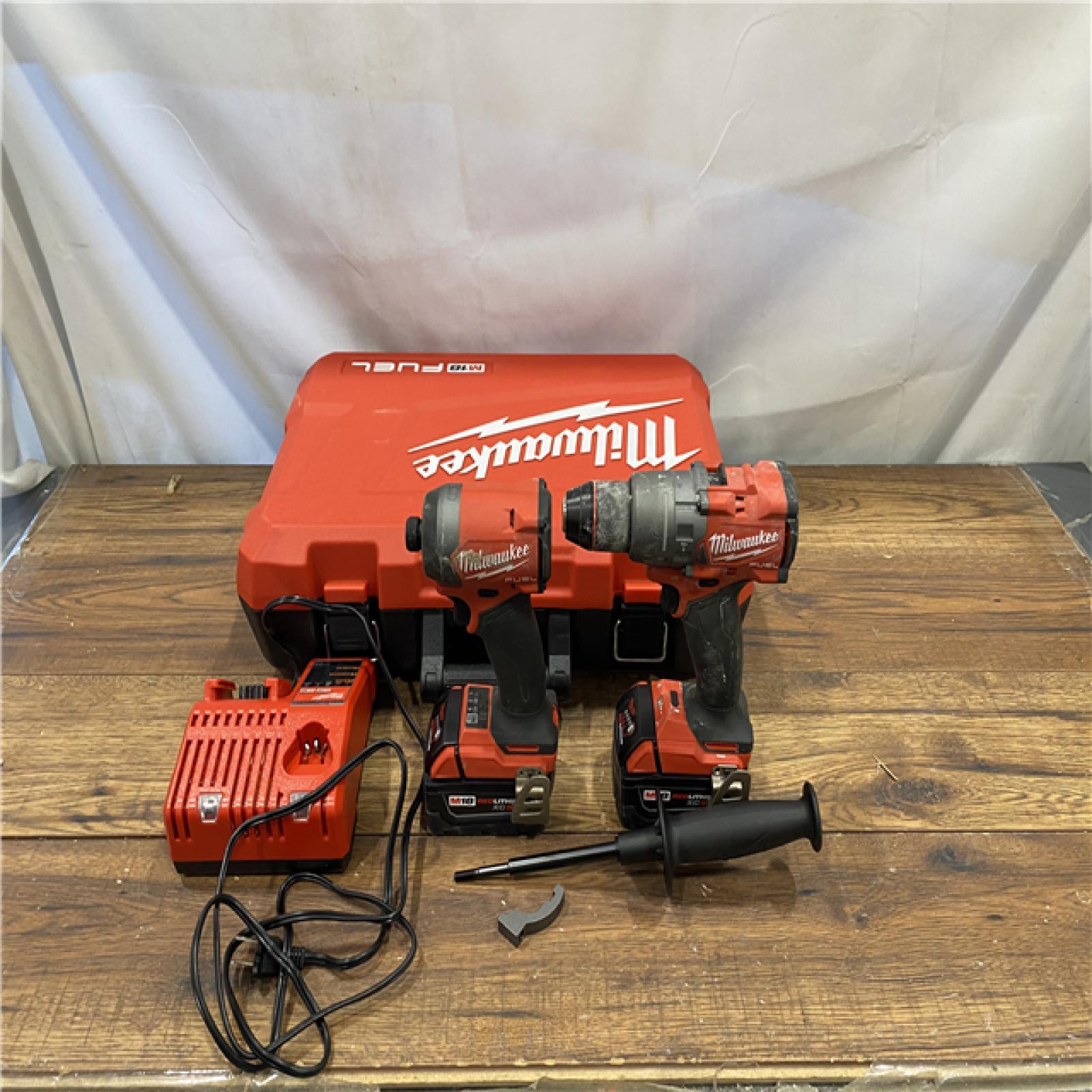 AS IS Milwaukee M18 FUEL 18V Lithium-Ion Brushless Cordless Hammer Drill and Impact Driver Combo Kit (2-Tool) with 2 Batteries