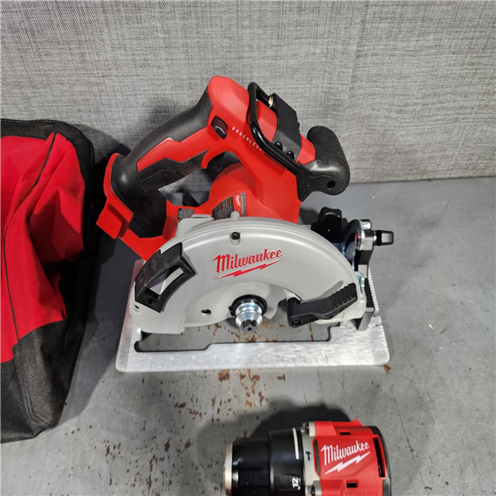 HOUSTON LOCATION - AS-IS Milwaukee M18 18-Volt Lithium-Ion Brushless Cordless Combo Kit (4-Tool) with 2-Batteries, 1-Charger and Tool Bag