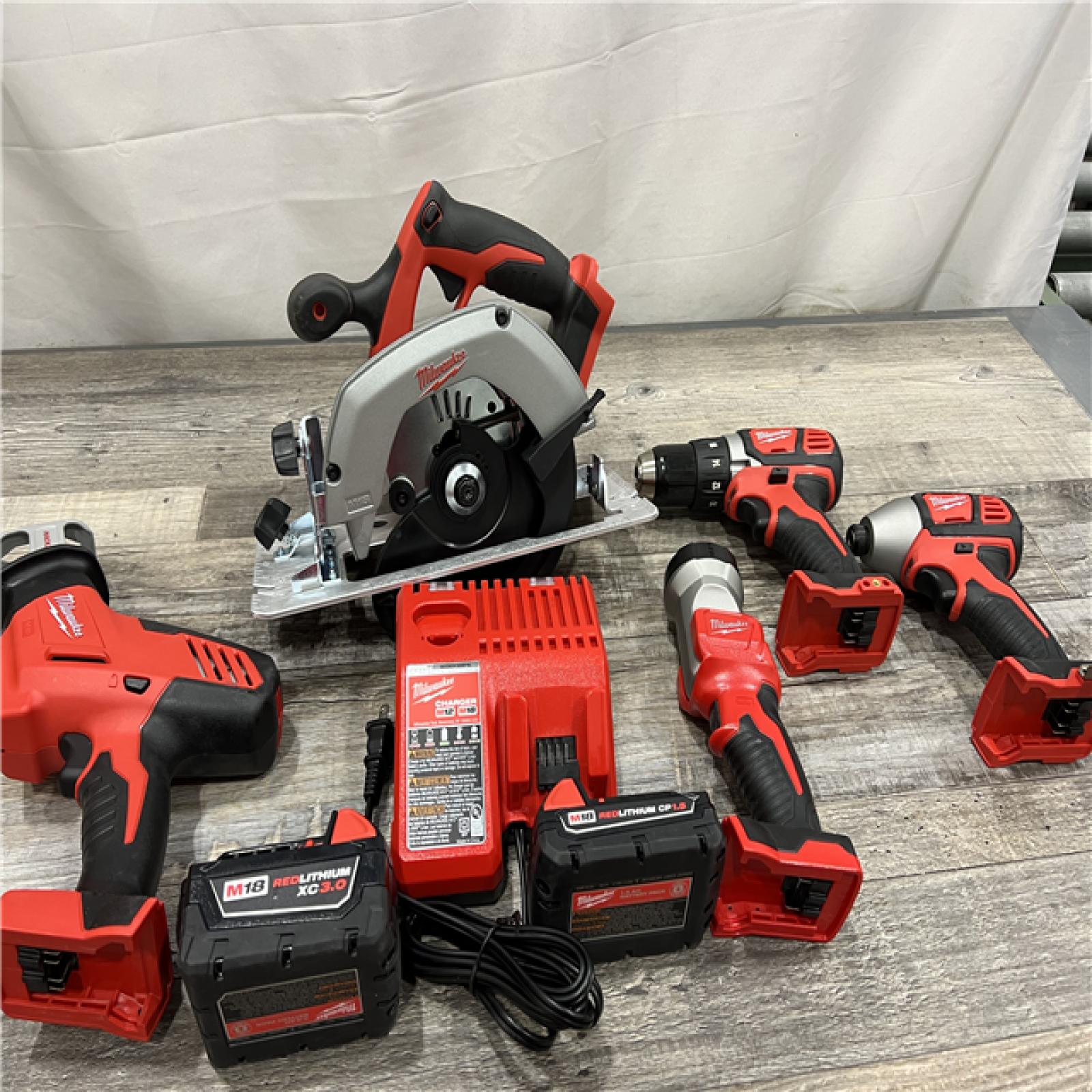 AS-IS Milwaukee M18 18-Volt Lithium-Ion Cordless Combo Tool Kit (5-Tool) with (1) 3.0Ah and (1) 1.5Ah Battery, (1) Charger, (1) Tool Bag