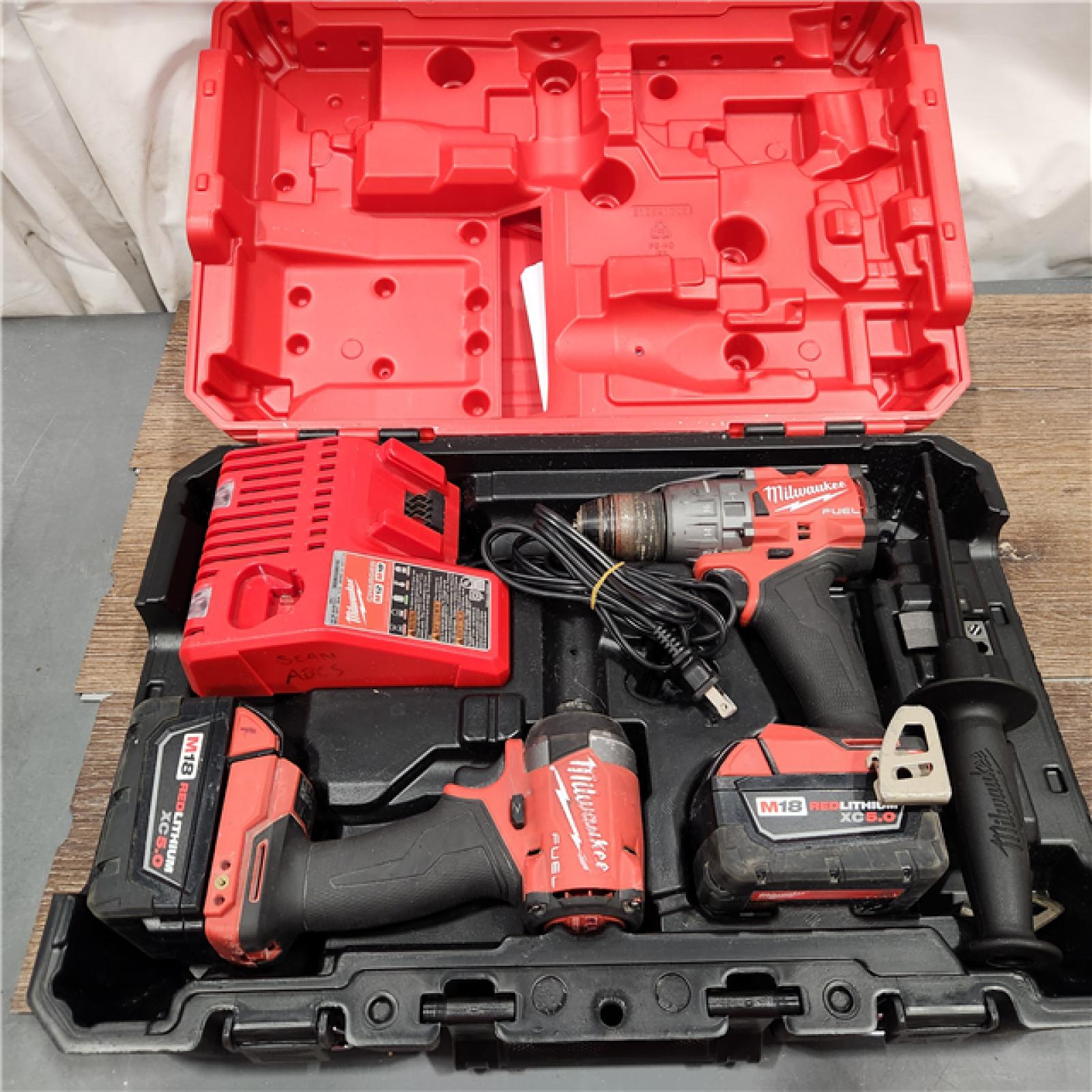 AS-IS Milwaukee M18 FUEL 18V Lithium-Ion Brushless Cordless Hammer Drill and Impact Driver Combo Kit (2-Tool) with 2 Batteries