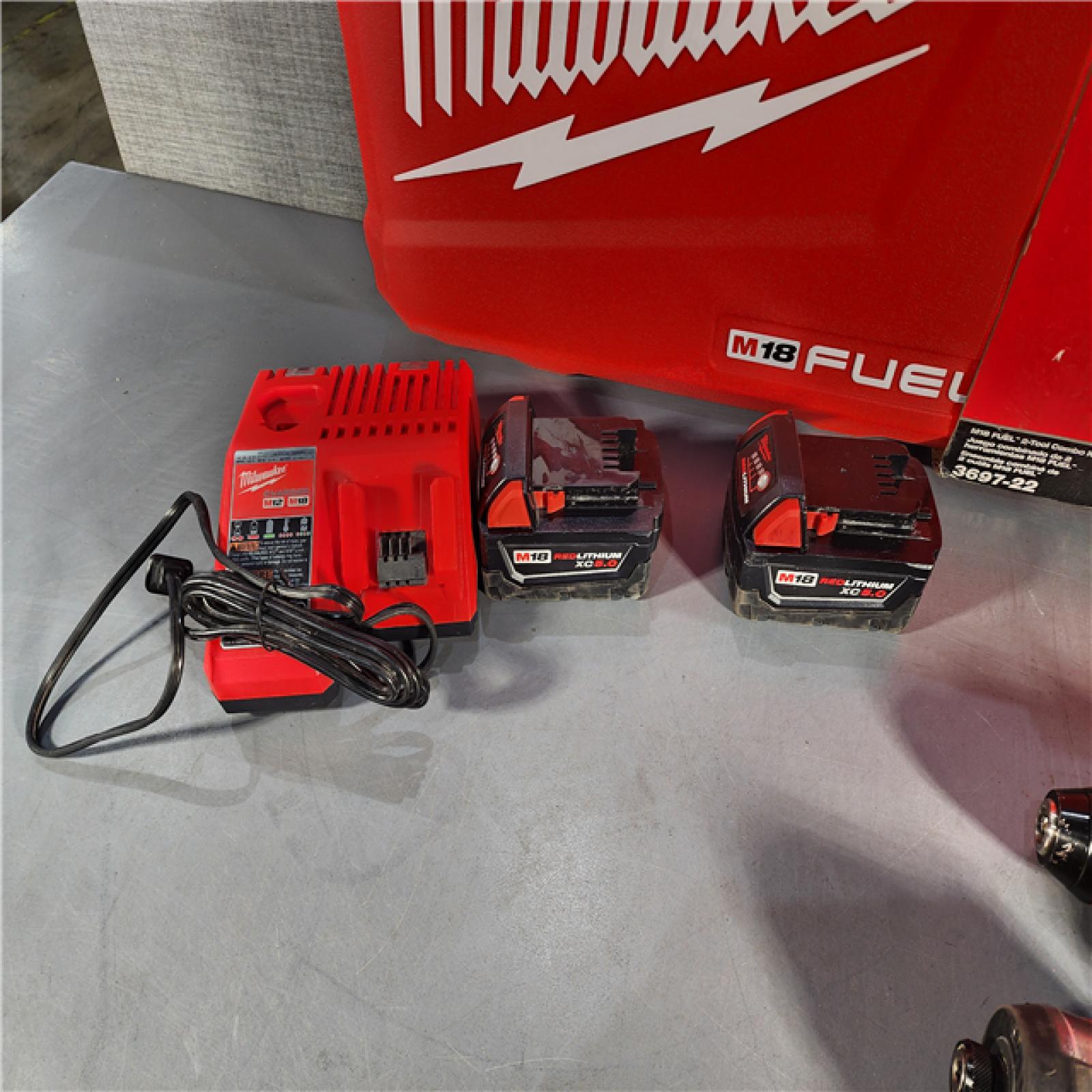 HOUSTON LOCATION - AS-IS Milwaukee M18 FUEL 18V Lithium-Ion Brushless Cordless Hammer Drill and Impact Driver Combo Kit (2-Tool) with 2 Batteries