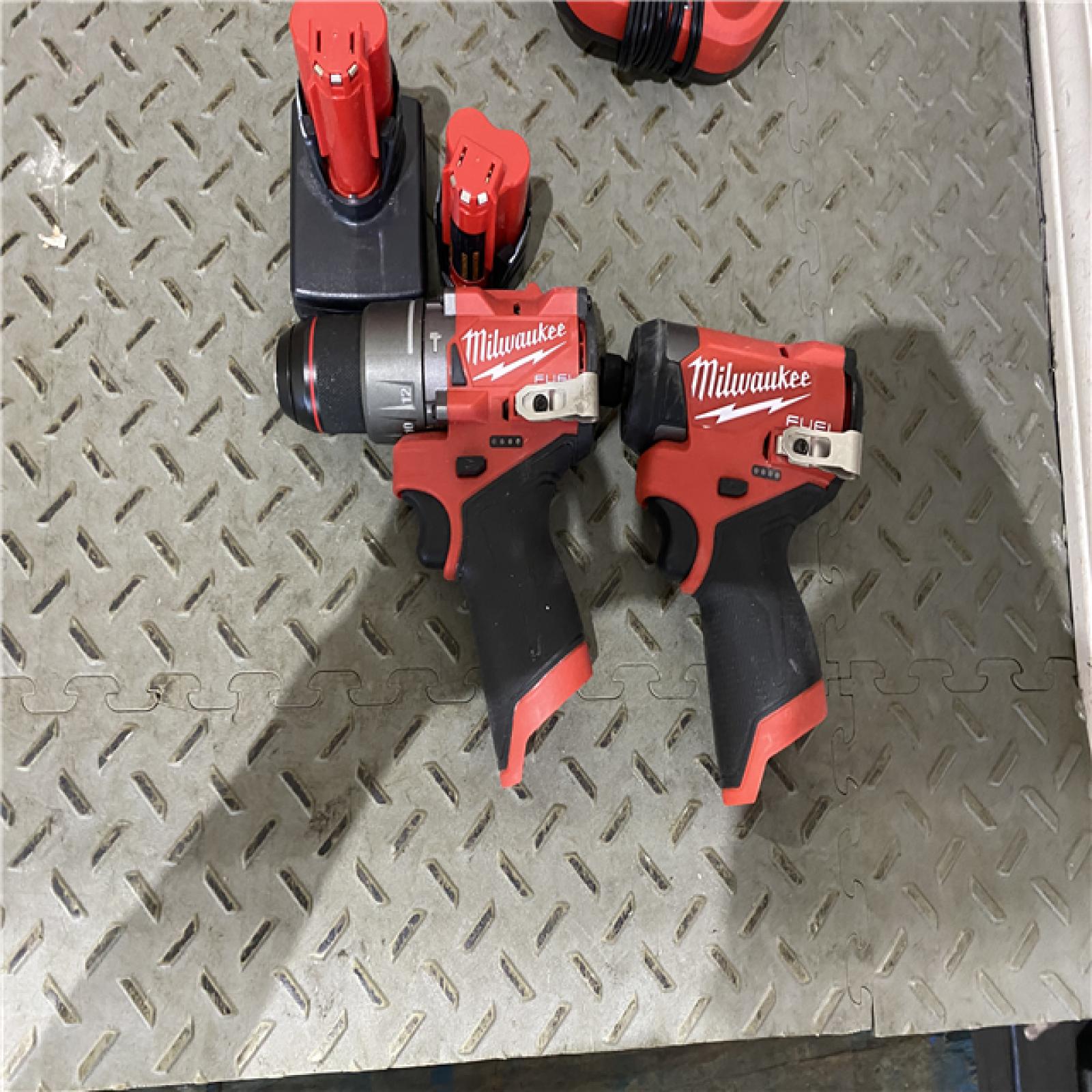 Houston location AS-IS  Milwaukee 3497-22 12V Brushless Hammer Drill and Impact Driver Combo Kit