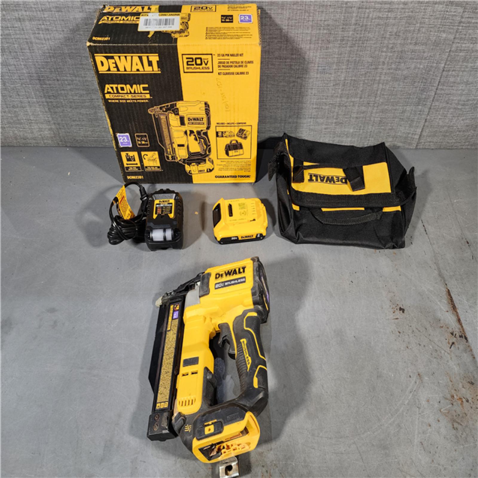 HOUSTON LOCATION - AS-IS DEWALT ATOMIC 20V MAX Lithium Ion Cordless 23 Gauge Pin Nailer Kit with 2.0Ah Battery and Charger