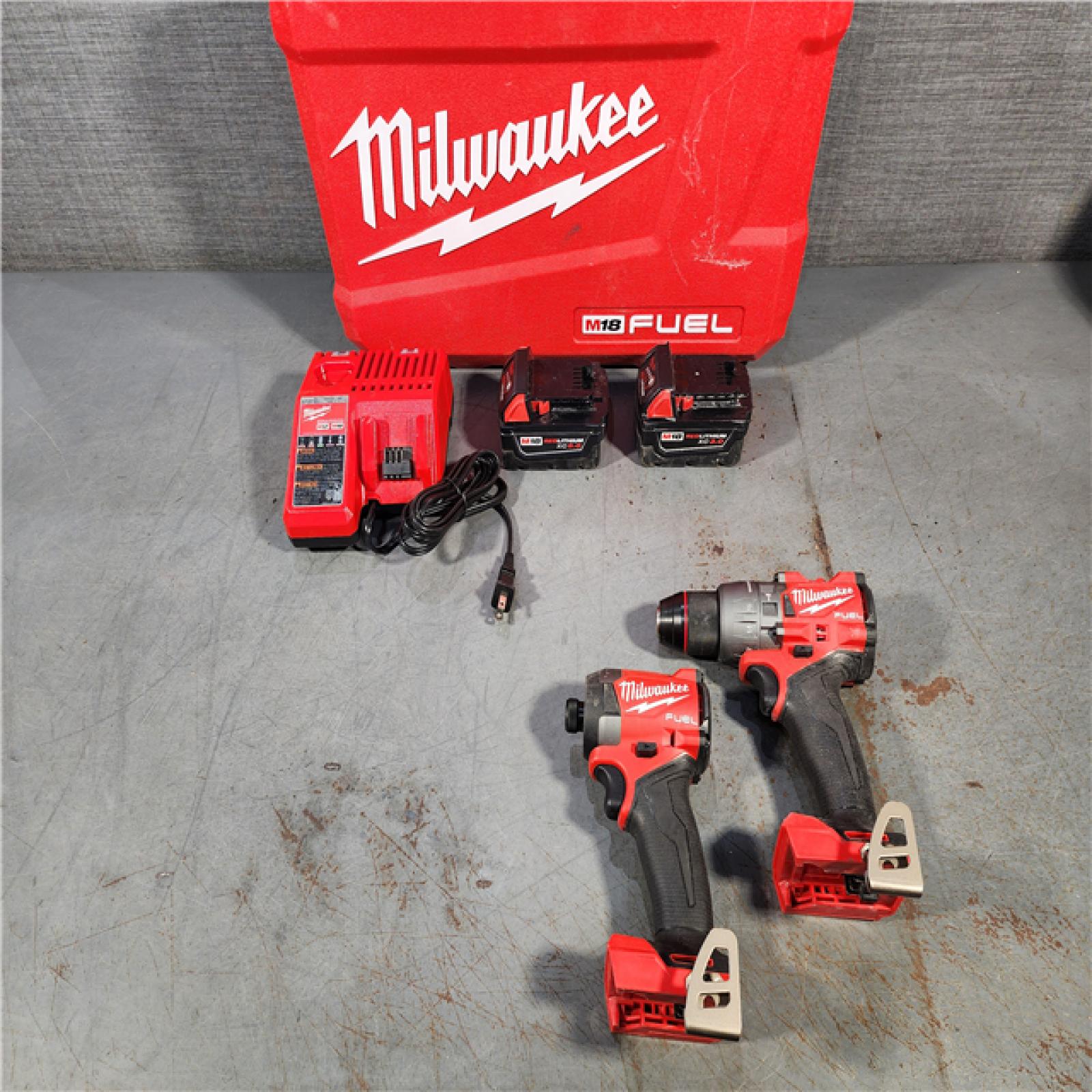 HOUSTON LOCATION - AS-IS Milwaukee M18 FUEL 18V Lithium-Ion Brushless Cordless Hammer Drill and Impact Driver Combo Kit (2-Tool) with 2 Batteries