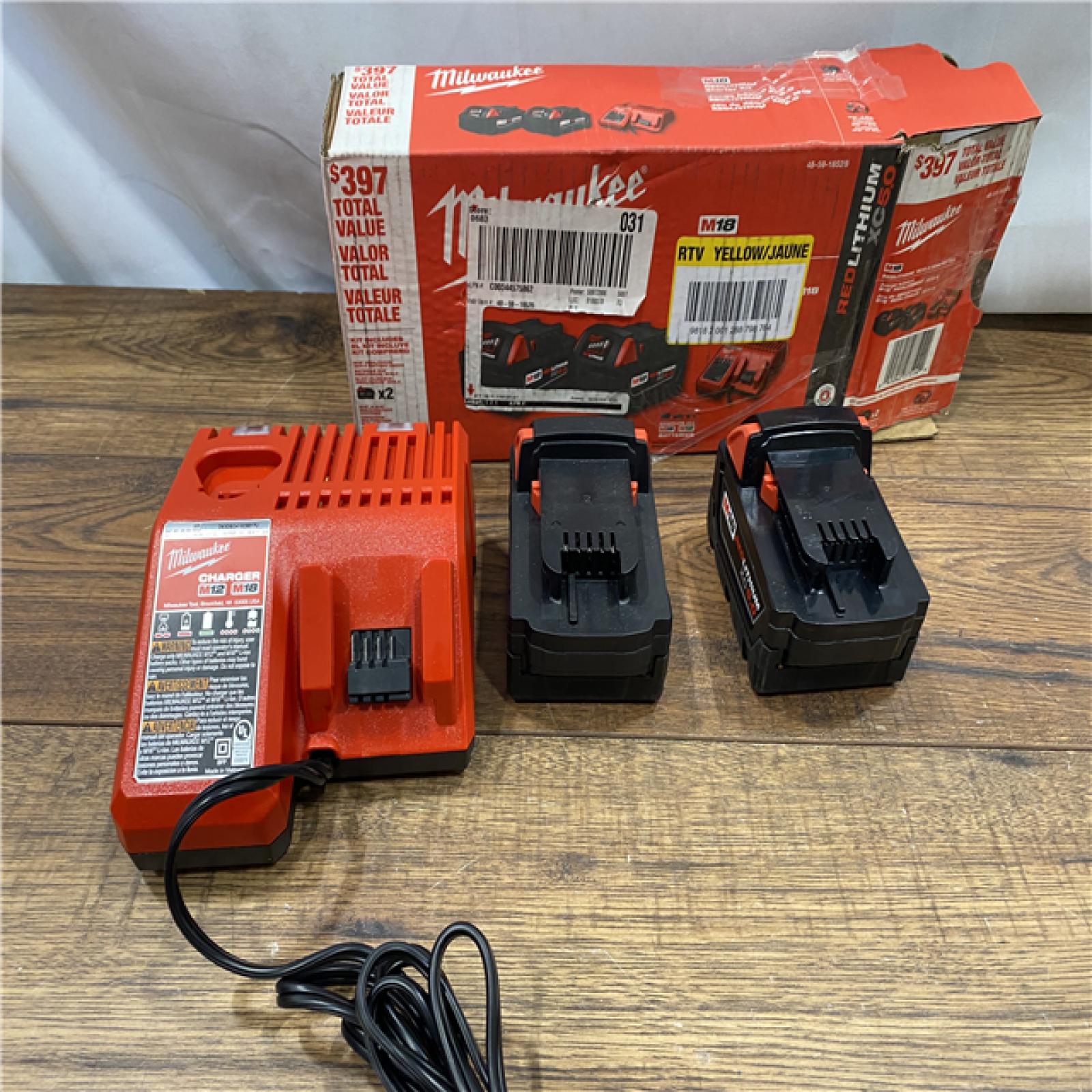 AS IS Milwaukee M18 18-Volt Lithium-Ion XC Starter Kit with Two 5.0Ah Batteries / Charger (48-59-1852B)