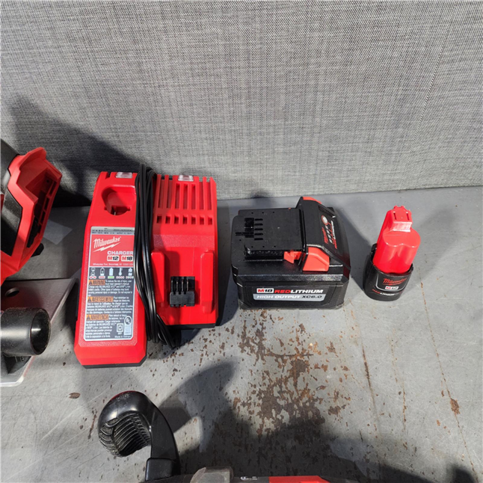 HOUSTON LOCATION - AS-IS MILWAUKEE 4 TOOL COMBO KIT W/ (2) BATTERY & CHARGER