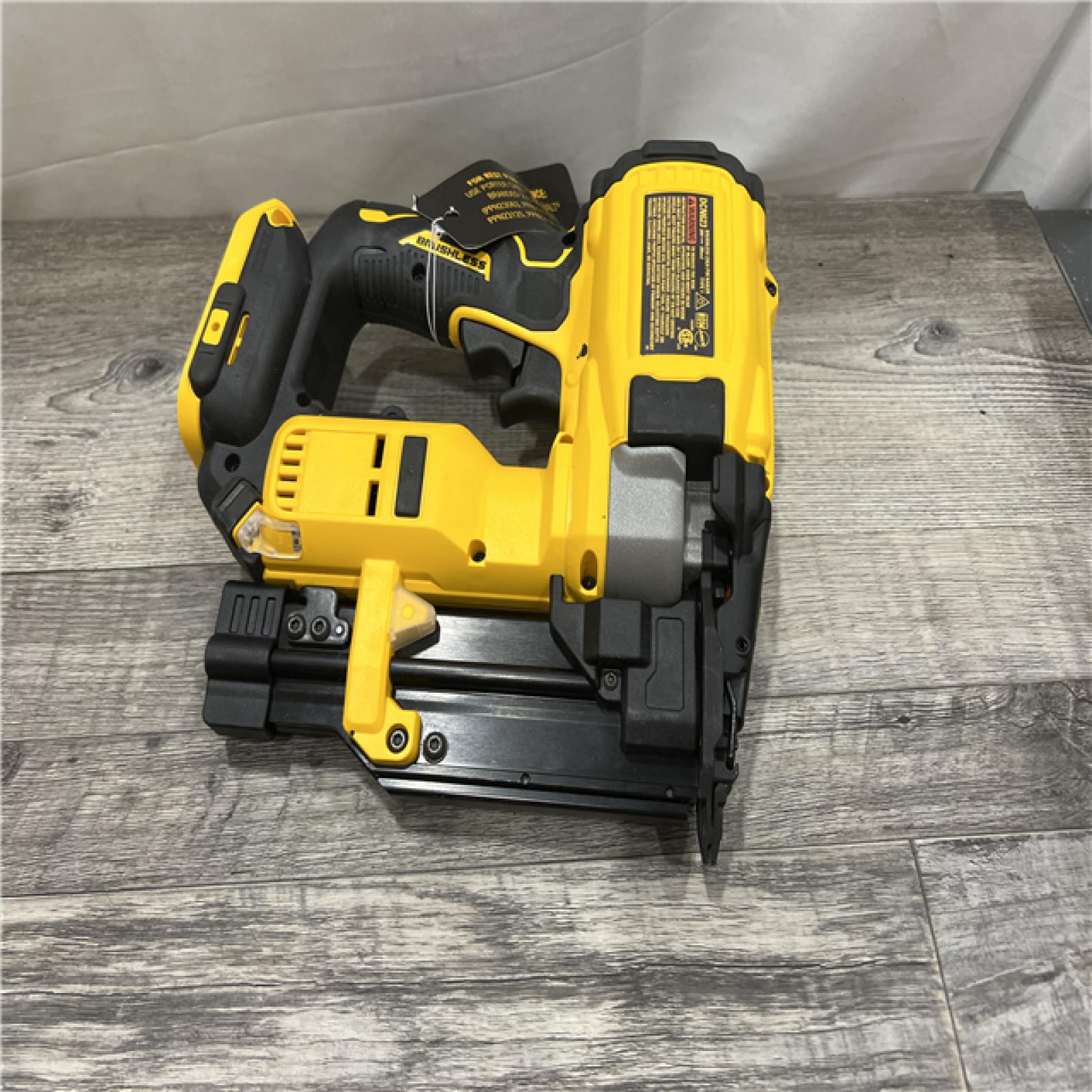 AS-IS DEWALT ATOMIC 20V MAX Lithium Ion Cordless 23 Gauge Pin Nailer Kit with 2.0Ah Battery and Charger