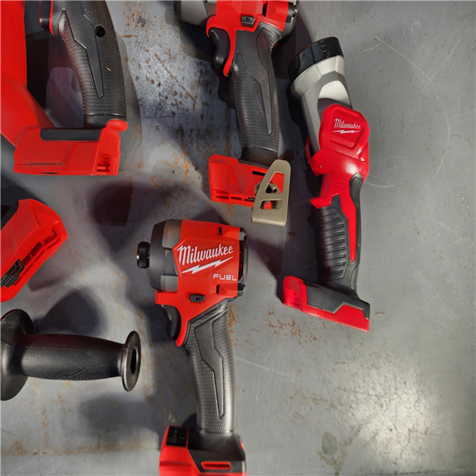 HOUSTON LOCATION - AS-IS (APPEARS LIKE NEW) Milwaukee M18 FUEL 18V Lithium-Ion Brushless Cordless Combo Kit with Two 5.0 Ah Batteries  1 Charger  2 Tool Bags (7-Tool)