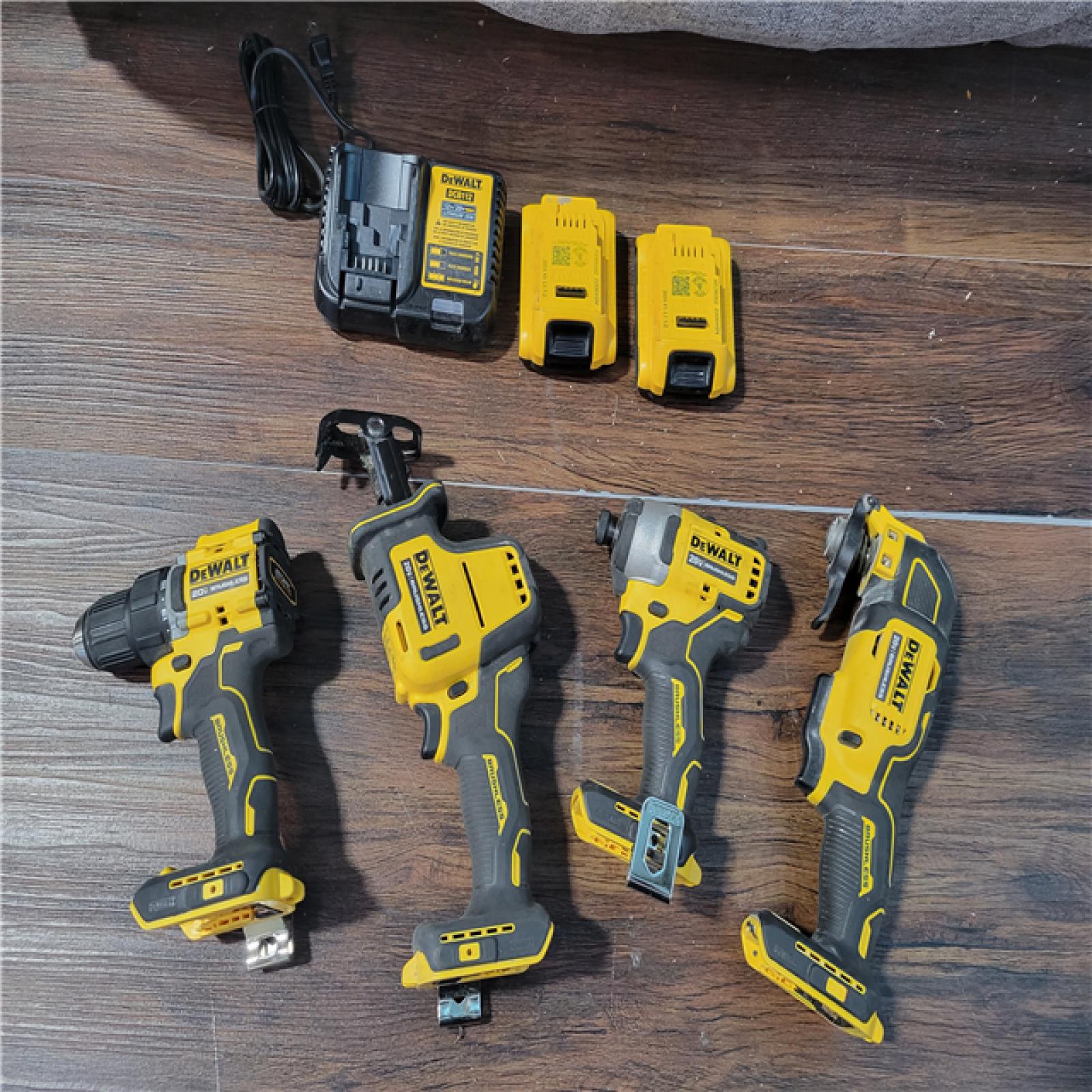 California As-Is Dewalt Brushless 4-Tool Combo Kit (Battery,Charger, and Tool Bag Included)