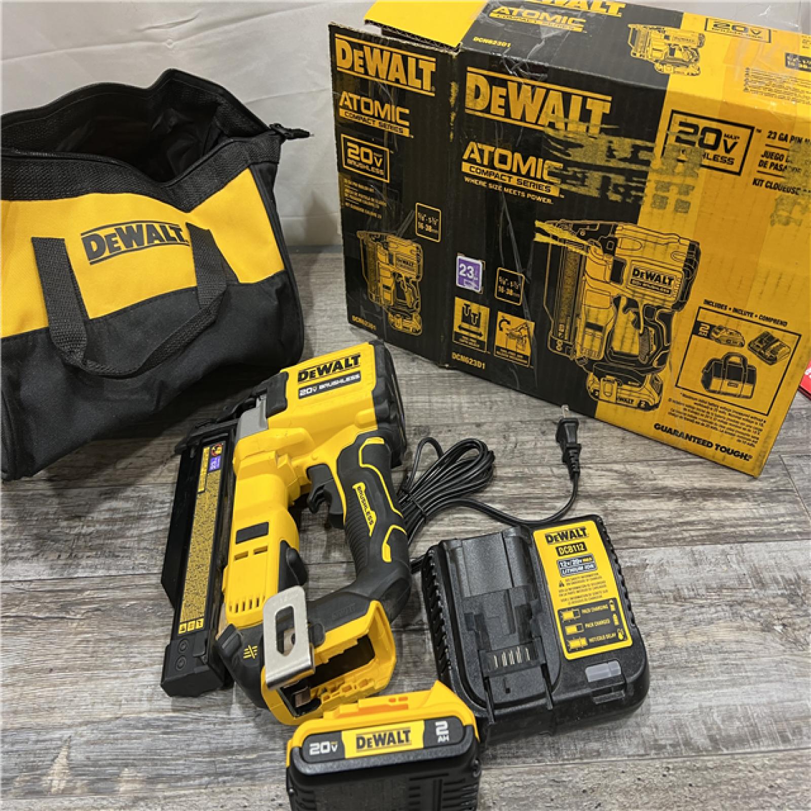 AS-IS DEWALT ATOMIC 20V MAX Lithium Ion Cordless 23 Gauge Pin Nailer Kit with 3.0Ah Battery and Charger