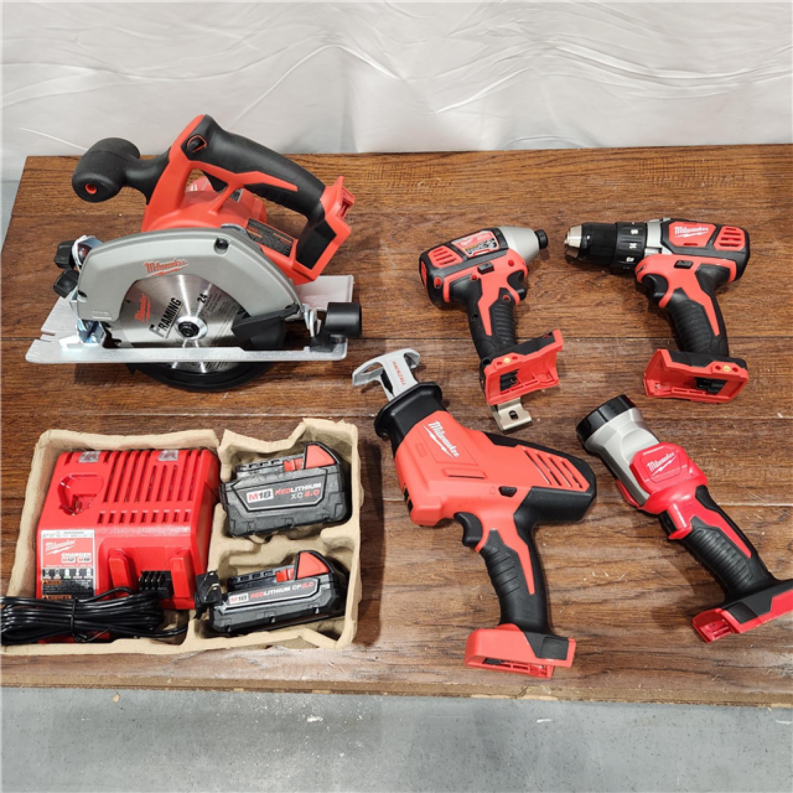 AS-IS Milwaukee M18 18-Volt Lithium-Ion Cordless Combo Tool Kit (5-Tool) with (1) 3.0Ah and (1) 1.5Ah Battery, (1) Charger, (1) Tool Bag