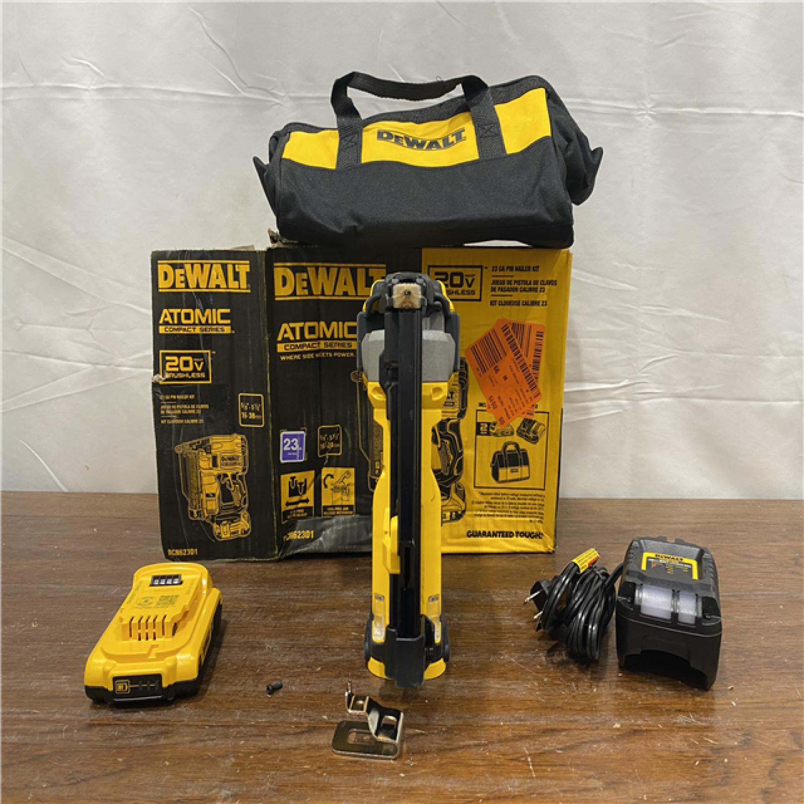 AS-IS DEWALT ATOMIC 20V MAX Lithium Ion Cordless 23 Gauge Pin Nailer Kit with 3.0Ah Battery and Charger