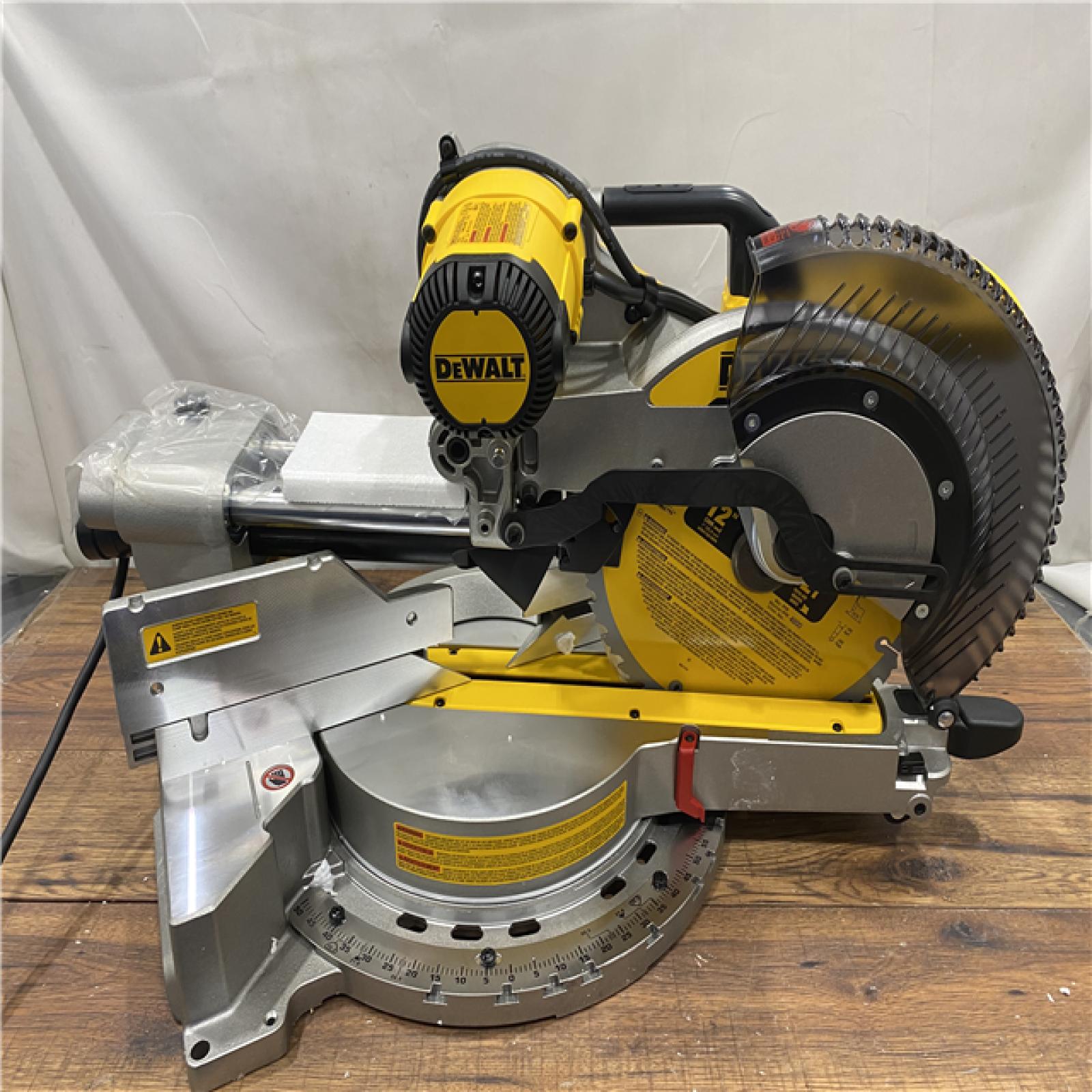 AS IS DEWALT 15 Amp Corded 12 in. Double Bevel Sliding Compound Miter Saw, Blade Wrench and Material Clamp