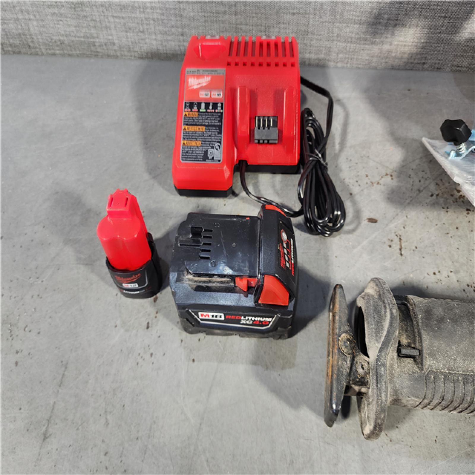 HOUSTON LOCATION - AS-IS MILWAUKEE 4 TOOL COMBO KIT W/ (2) BATTERY & CHARGER