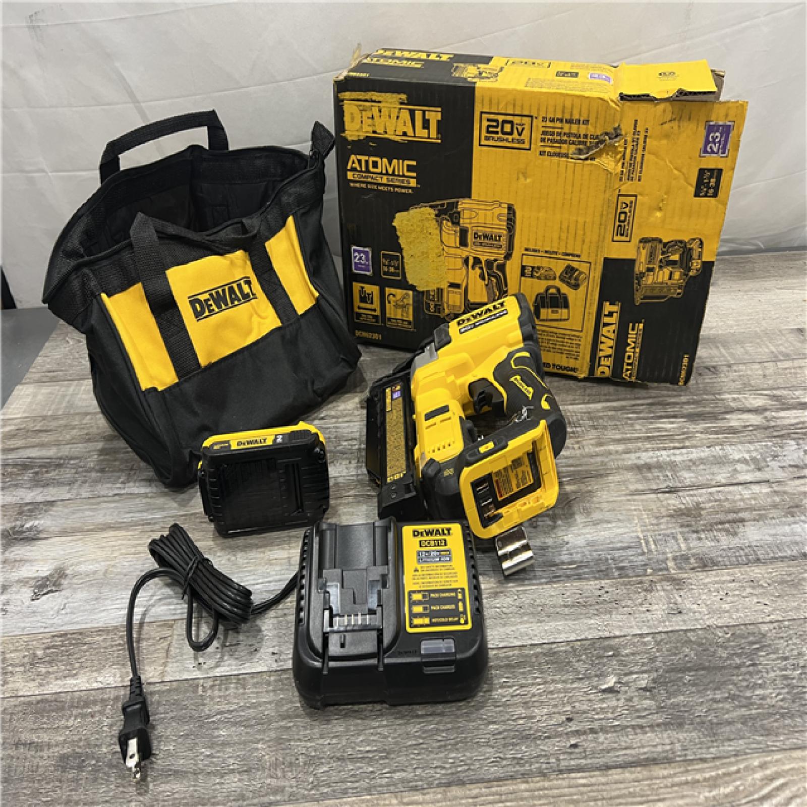 AS-IS DEWALT ATOMIC 20V MAX Lithium Ion Cordless 23 Gauge Pin Nailer Kit with 2.0Ah Battery and Charger